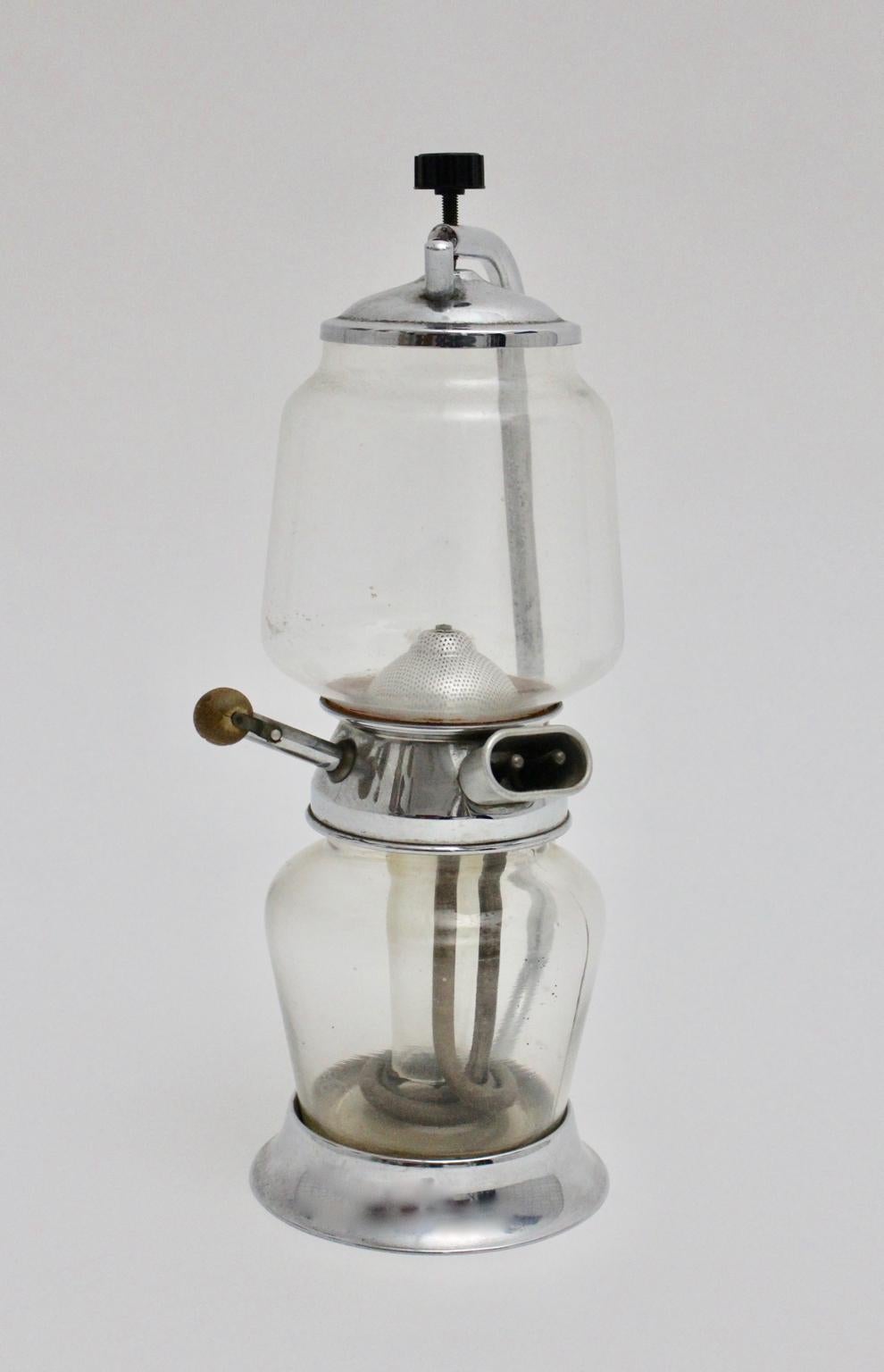 Art Deco Bauhaus era coffee machine designed 1920s, Hungary.
The coffee machine was made of chromed metal, glass and bakelite.
Electric vacuum ready - 600W - an electric cord is not included.

This machine is certainly a collector piece or a museum