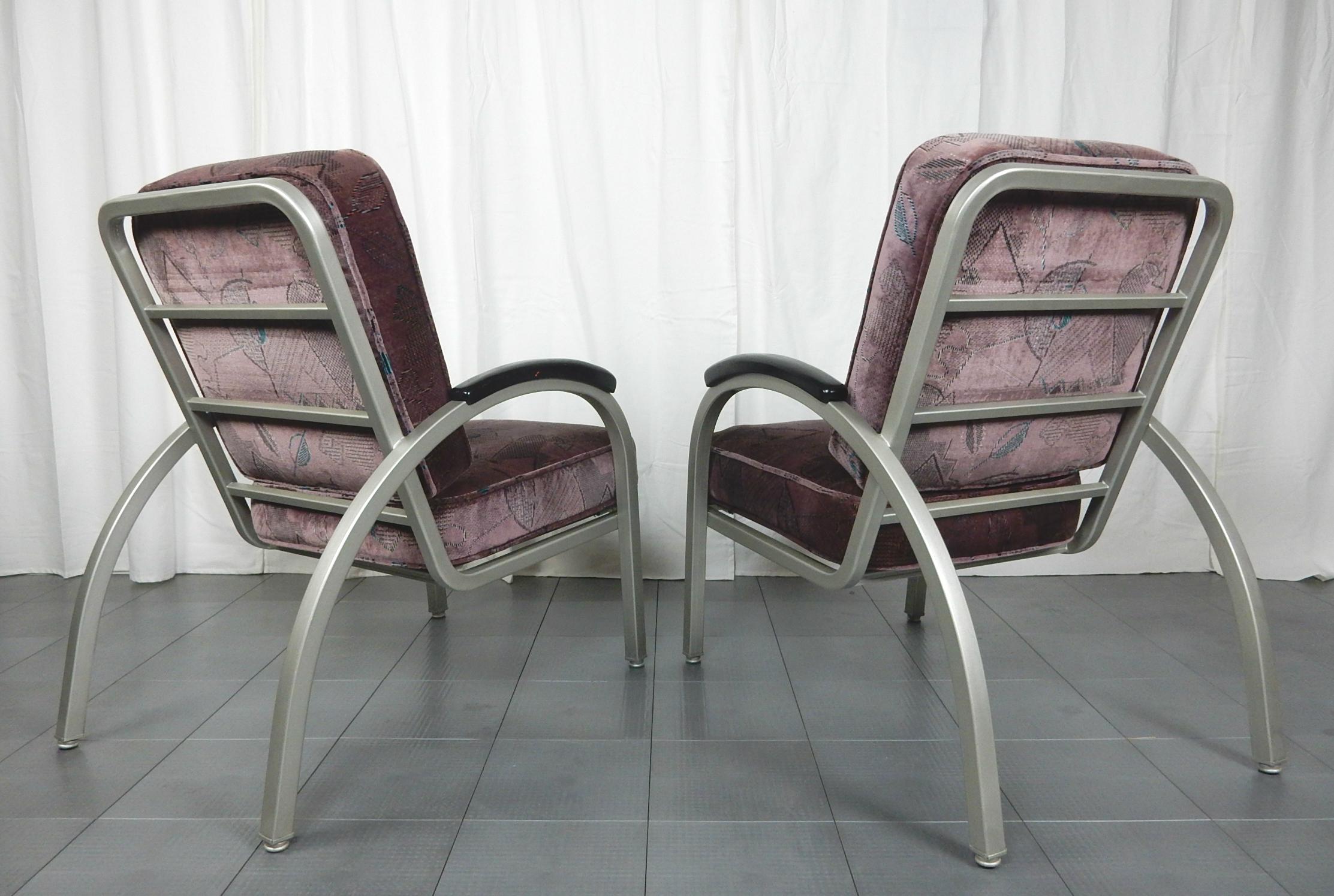 Pair of Streamline Moderne lounge chairs designed by Norman Bel Geddes
Frames are satin nickel painted with period velvet upholstered cushions with moderne design.
Both chairs are clean and in very good solid condition. Exceptionally