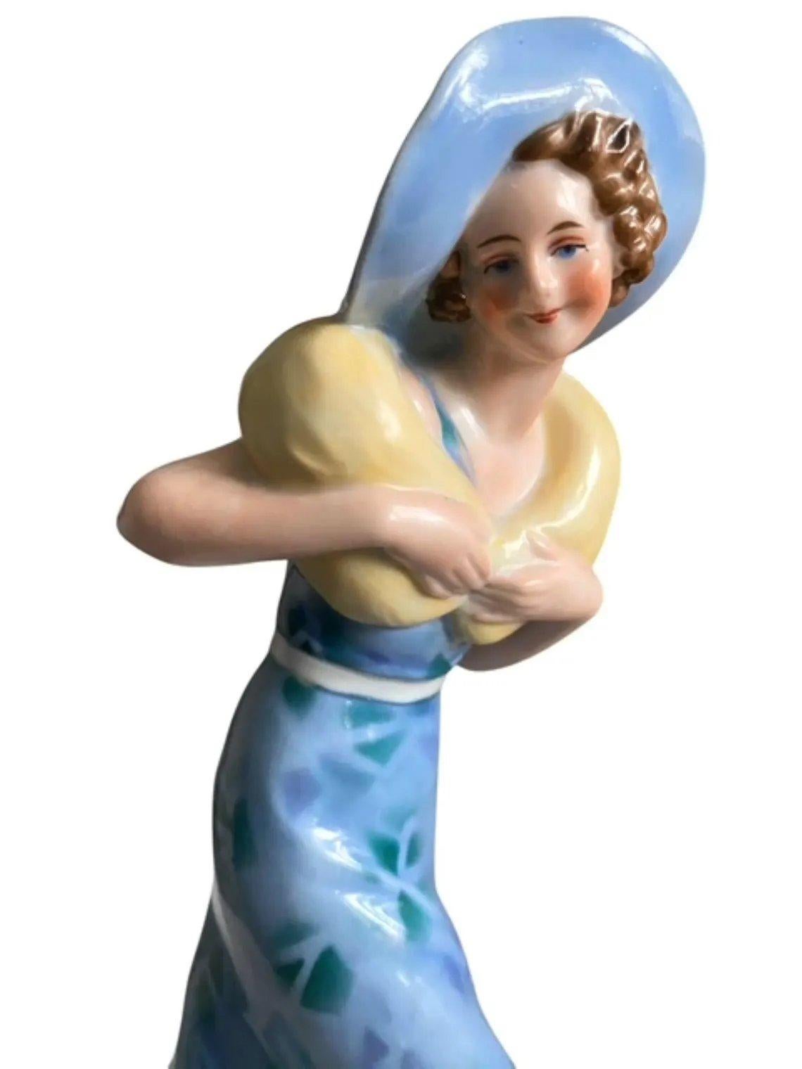 For your consideration is this very attractive and totally Art Deco glazed porcelain flapper girl figurine dating to around 1935. She's an impressive height standing 23.5 cm overall. This wonderful figure is in the form of a flapper girl dressed in