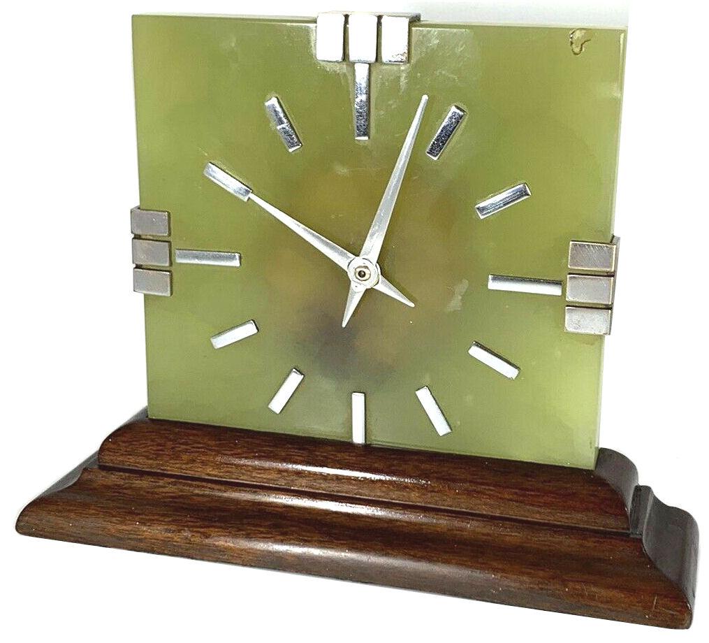 For your consideration is this in fabulous refurbished Art Deco mantle clock dating to the 1930's. This clock has a great look to it with chromed Roman numerals and polished chrome hands, wood stepped base and a beautiful Onyx marble body. It has a