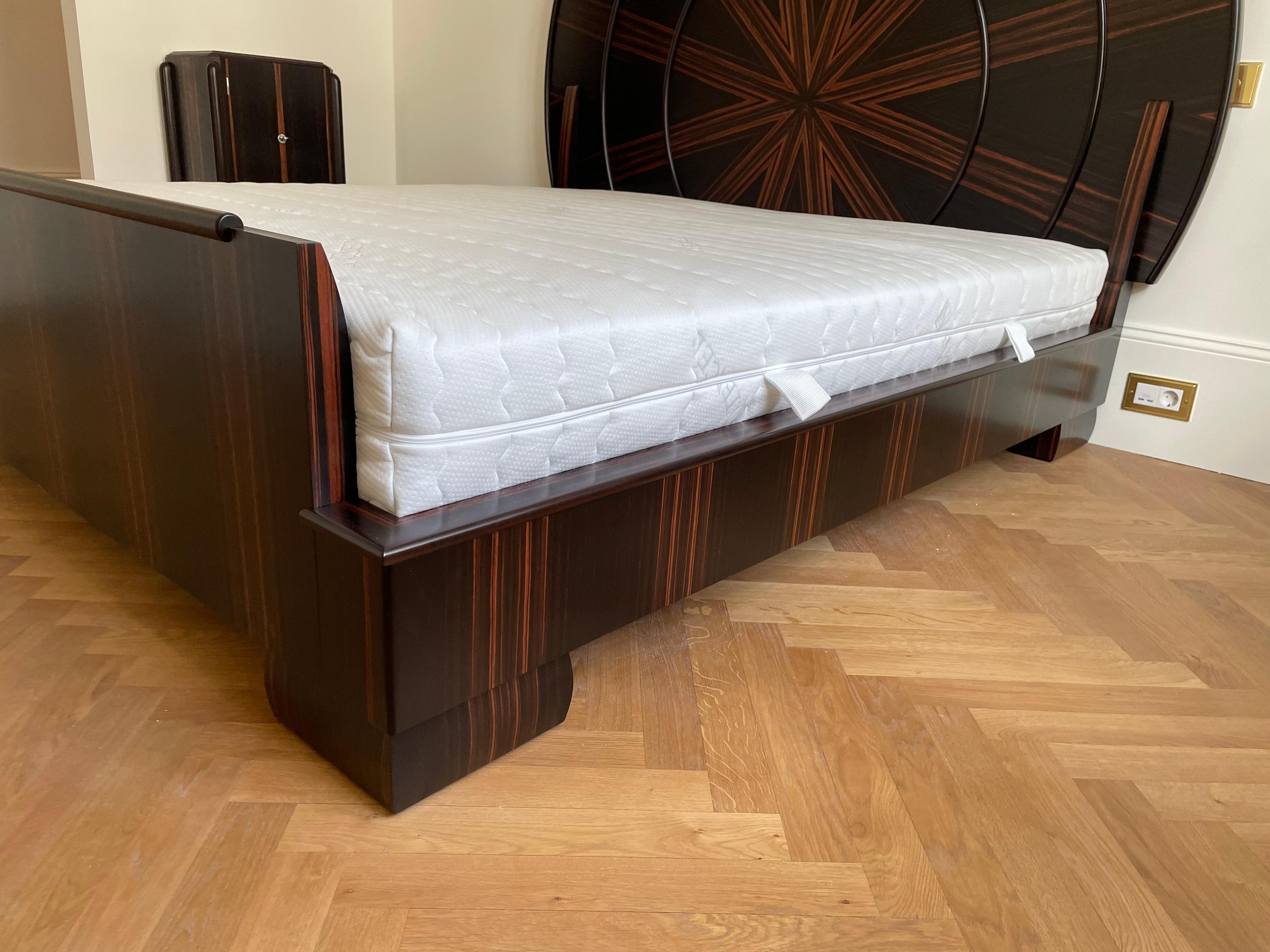 Impressive Art Deco bed in Macassar based heavily on the design by Émile-Jacques Ruhlmann. This wonderful bed is hand built by us with a lot of love for details. The bed shown is for a mattress with the dimensions: 200cm*180cm (the lying height is