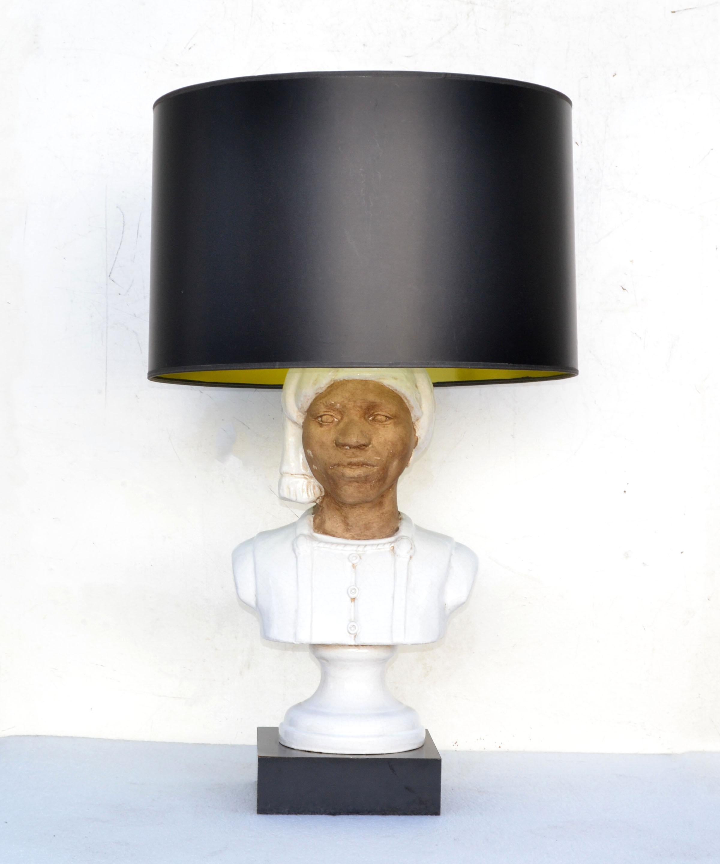 One of a kind bedouin head bust table lamp.
Bust is handmade out of Terracotta and Ceramic and mounted on a black lacquered base.
Marked at the reverse.
Wired for Europe, can be modified to US Rewiring. It is in perfect working condition and