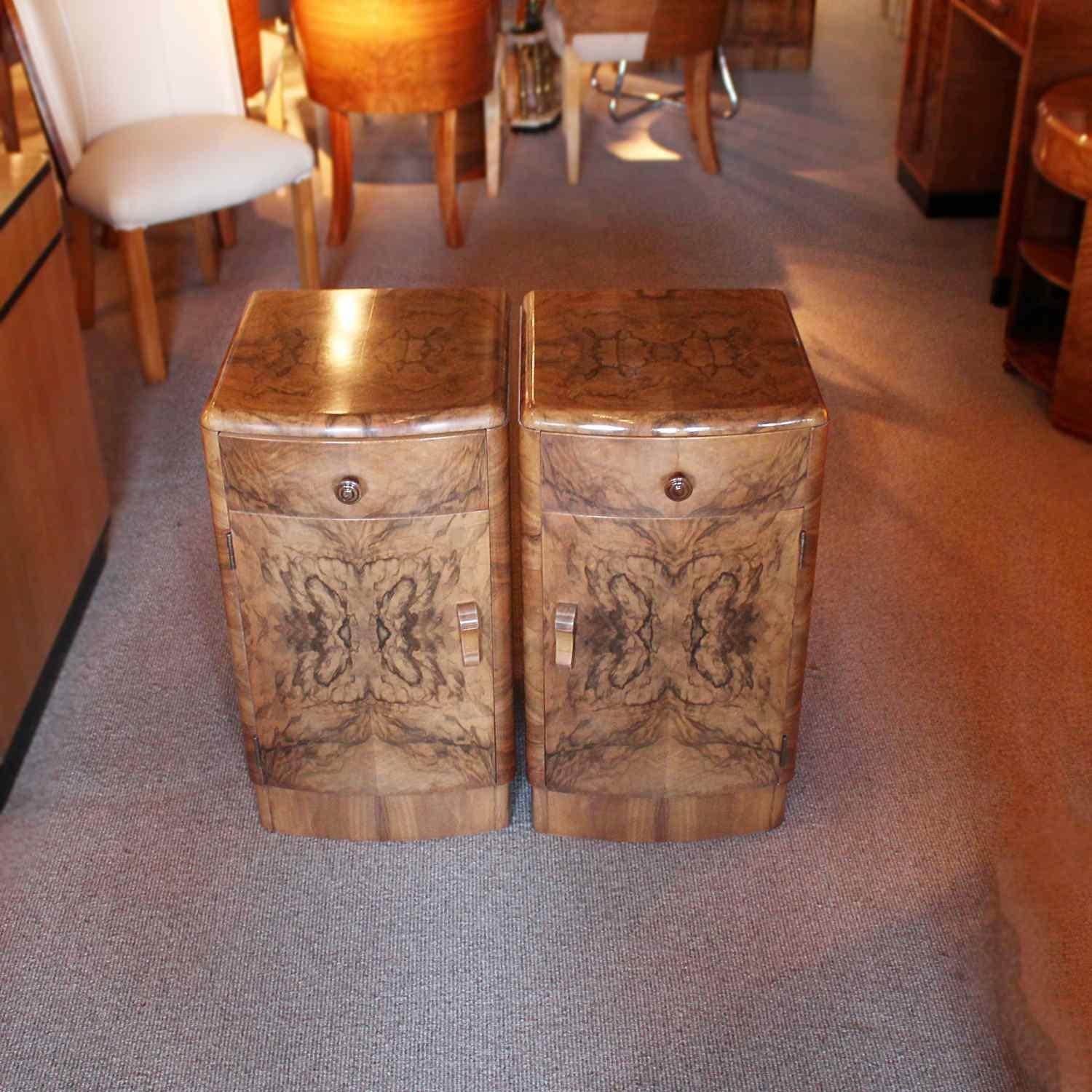 A pair of Art Deco bedside cabinets in figured walnut with original carved wooden handles. Drawer to top with shelved cabinet beneath.

Dimensions: H 66cm, W 37cm, D 40cm

Origin: English

Date: circa 1930

Item No: 608184.