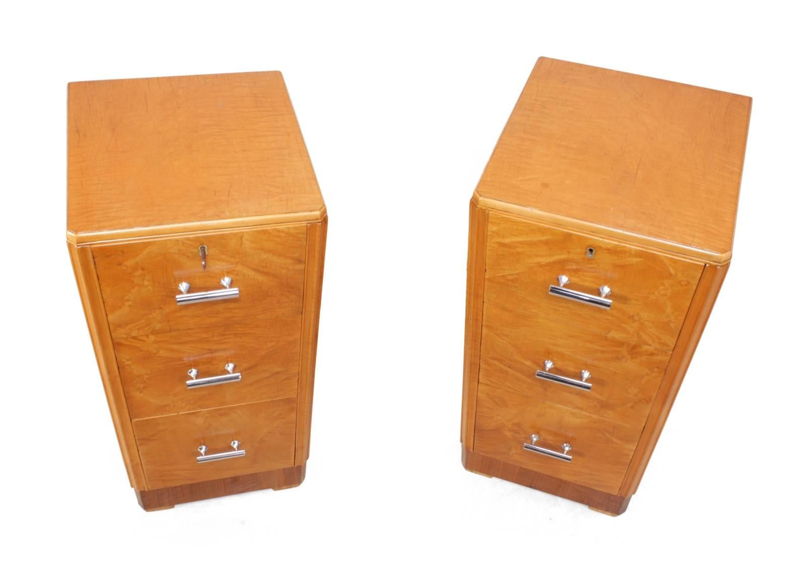 Art Deco bedside chests by Maple & Co.
This pair of 1930s bedside chests produced in England by Maple & Co. London are in very good restored condition, with three graduated drawers in each and chromed handles top drawers are lockable with one key