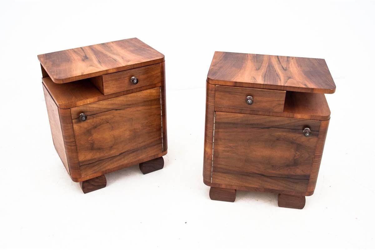 Art Deco bedside tables, Poland, 1960s.

Very good condition.

After professional renovation.

Wood: walnut

Dimensions: height 59 cm, width 50 cm, depth 35.5 cm.