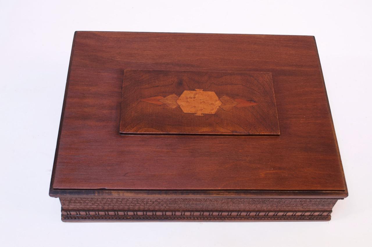 American deco beechwood decorative box with tiger maple inlay, circa 1940s. Appealing center decoration with intricate carved border detail. Suitable for cigar storage / can be used simply as a decorative / jewelry box.
Very nice, refinished