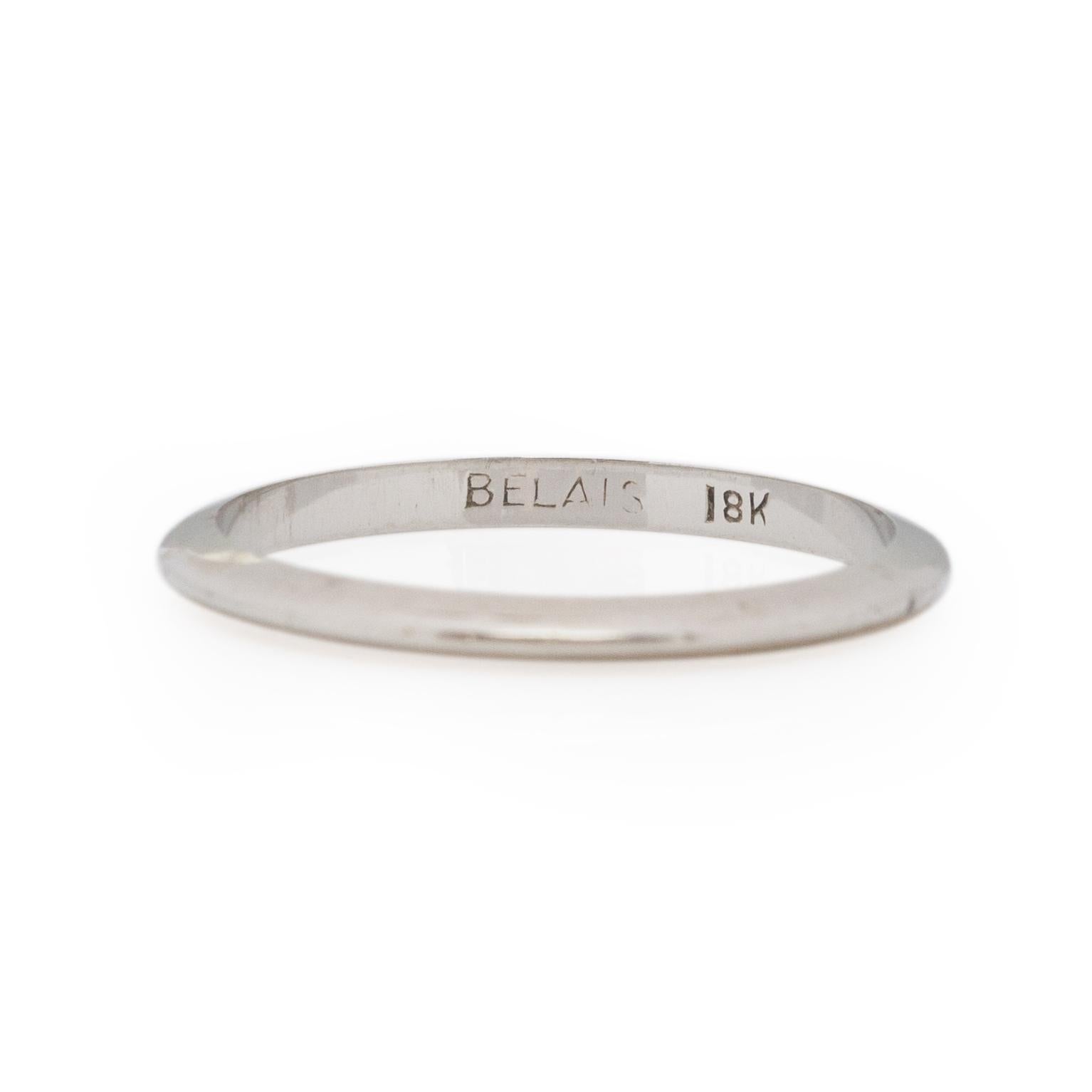 Here we have a simple thin knife edge Belais Bros wedding band. This piece has a great minimalist feel and is in wonderful condition for its age. This ring is very versatile, by means of who it is worn by and how. A beautiful addition to a vintage