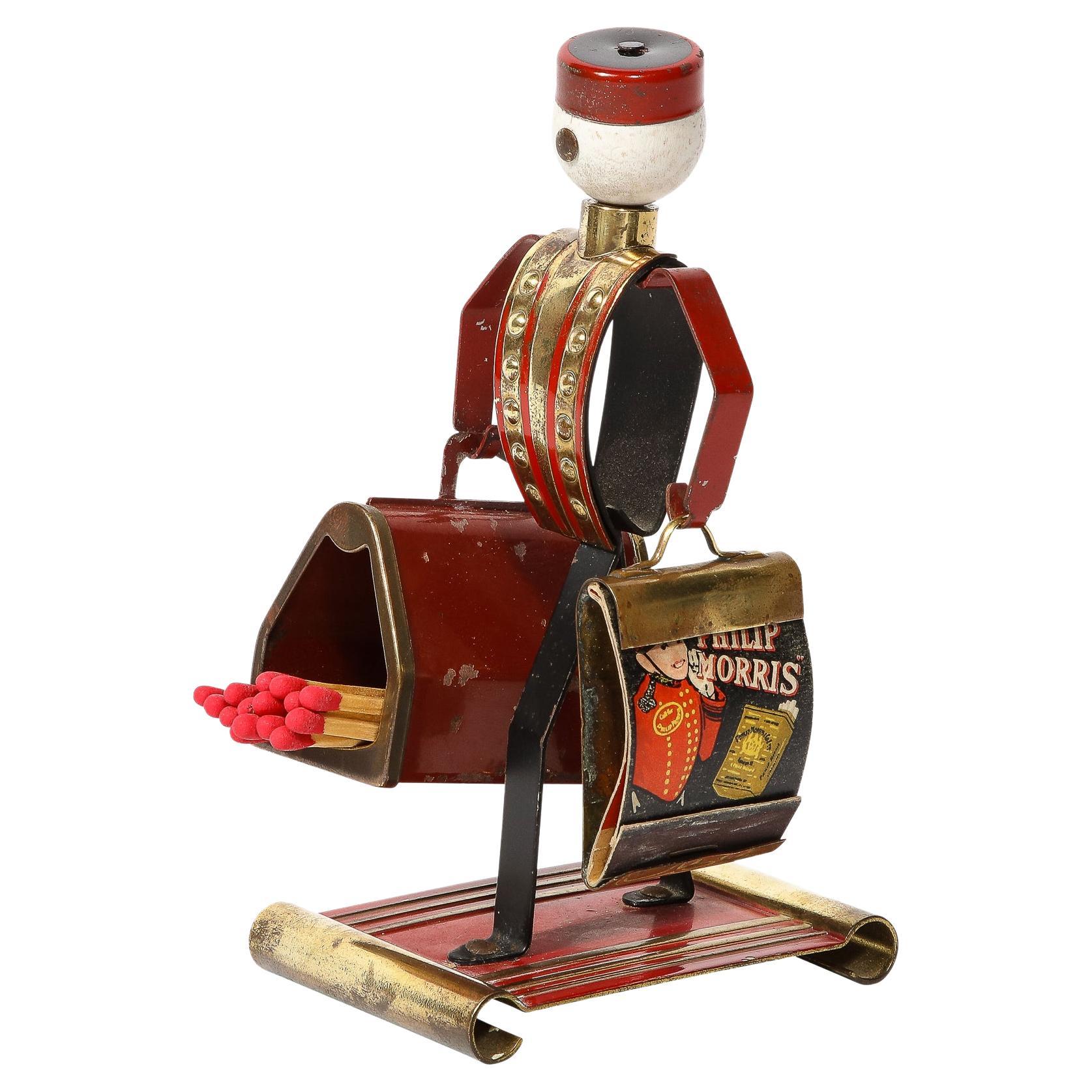 Art Deco Bellhop Figurine Cigarette Holder in Brass and Enamel by Philip Morris
