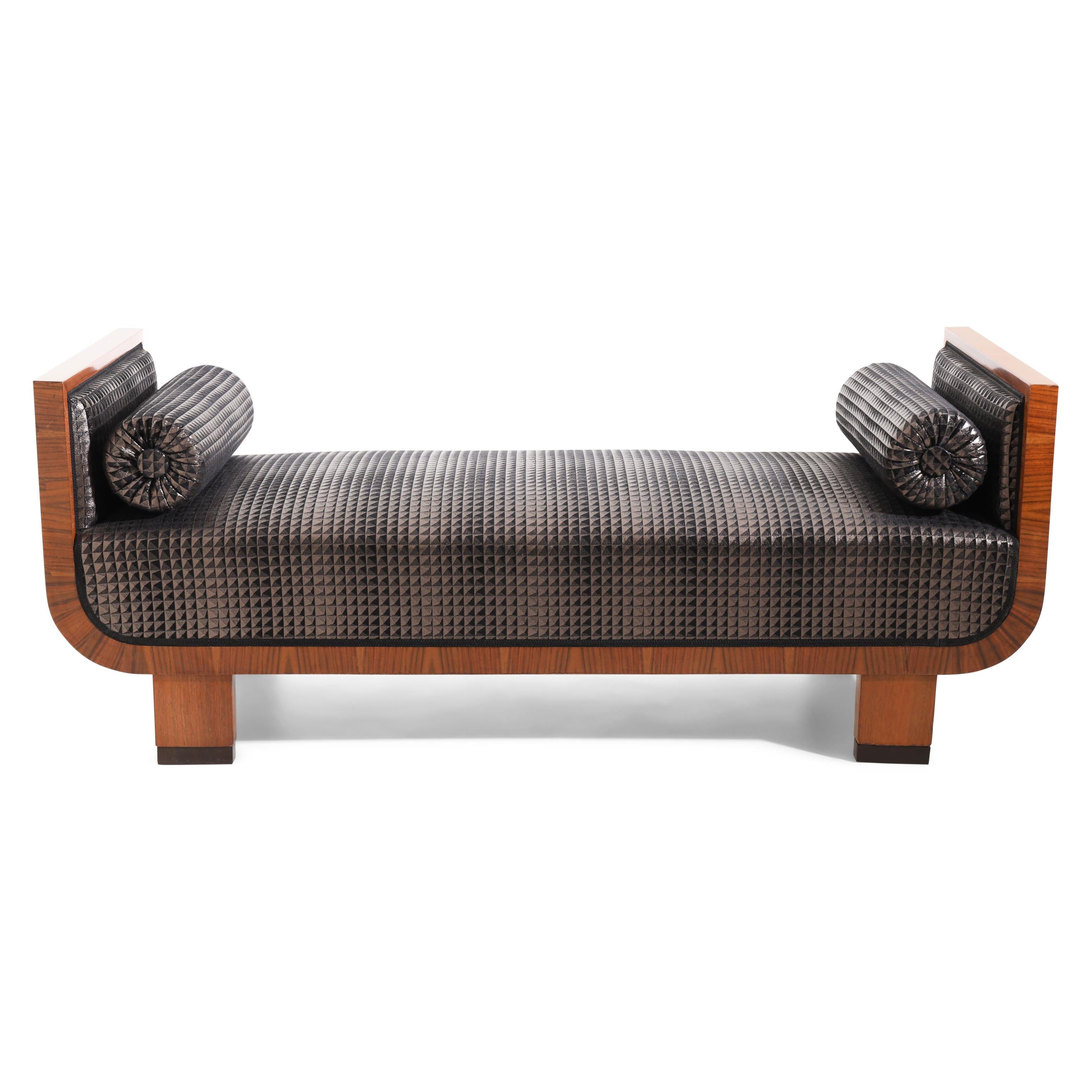 Art Deco bench with a U-shaped frame and flat legs with dark plinths. The sides end straight and are upholstered inside and outside. The sofa was hand-polished and is newly covered with a high-quality fabric in anthracite and silver-grey.