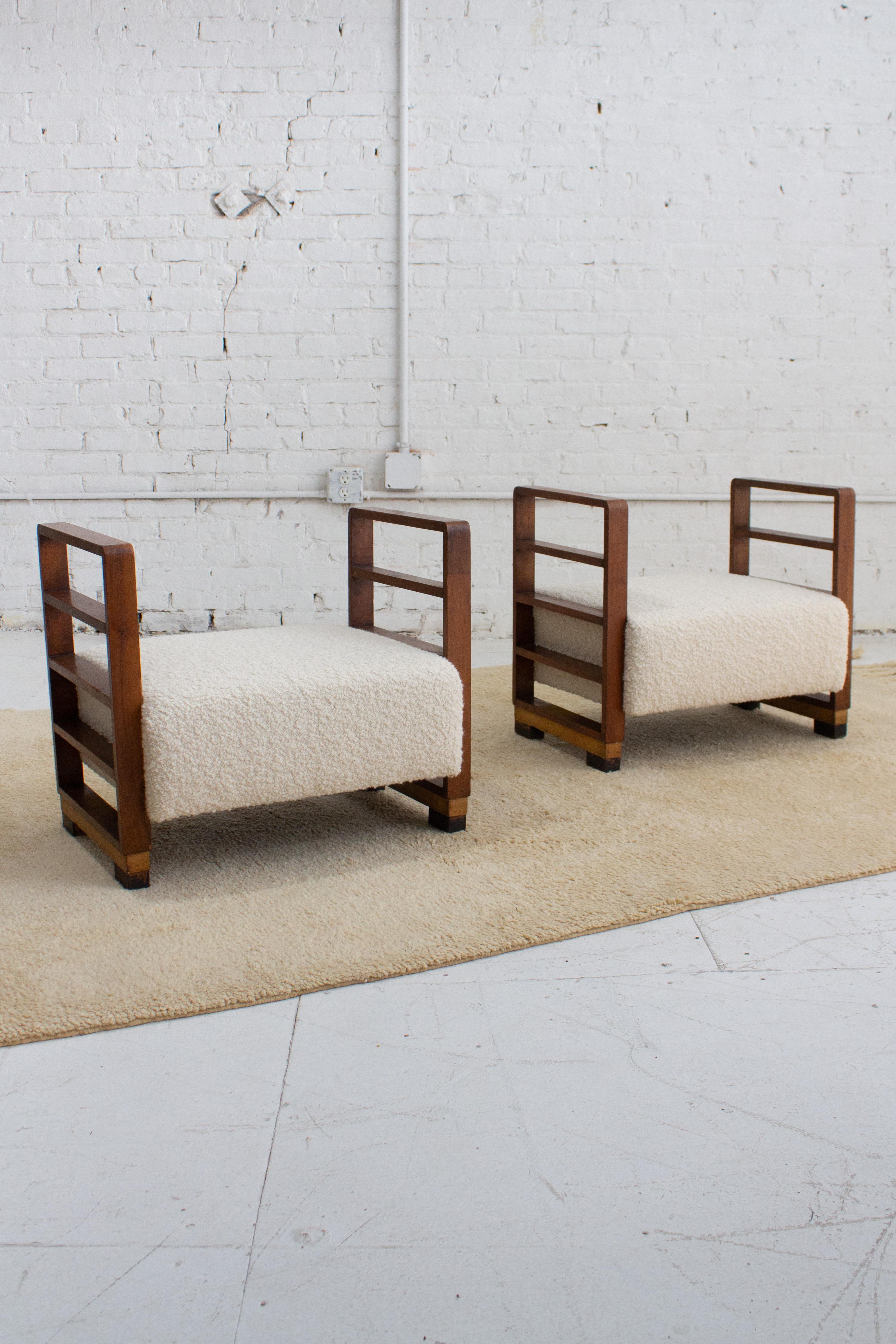 A pair of wooden benches attributed to Paolo Buffa for Arrighi. Wooden ladder style silhouette. Newly reupholstered in a high quality wool bouclé. Heavy patina on wood frames throughout. Sourced in Northern Italy. Sold a as set.