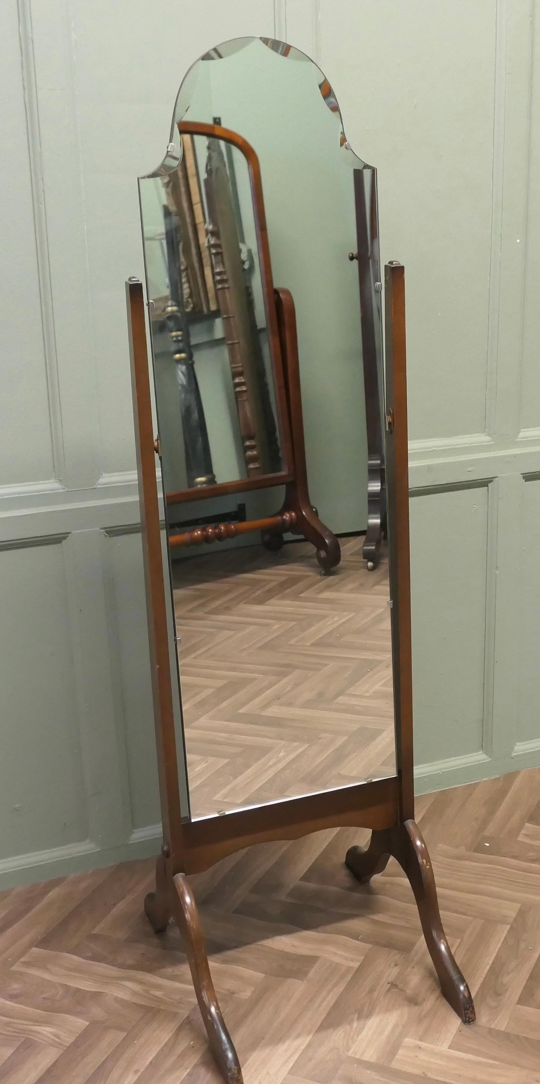 Art Deco Bevelled Top Cheval Mirror

The Mirror has an Arch shaped top which has a very unusual  bevelled scallop to the glass, it sits firmly in its stand and swivels for maximum advantage
The Stand is set on arching splayed feet, the mirror is in