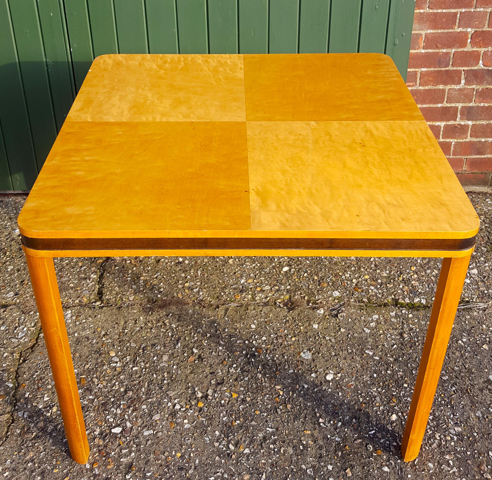 Very unusual Art Deco Biedermeier 95cm card table dining table in a highly French polished finish with inlaid detail on the edge.

It has simple legs to set off the wonderful figure of the main golden birch veneers and is structurally
