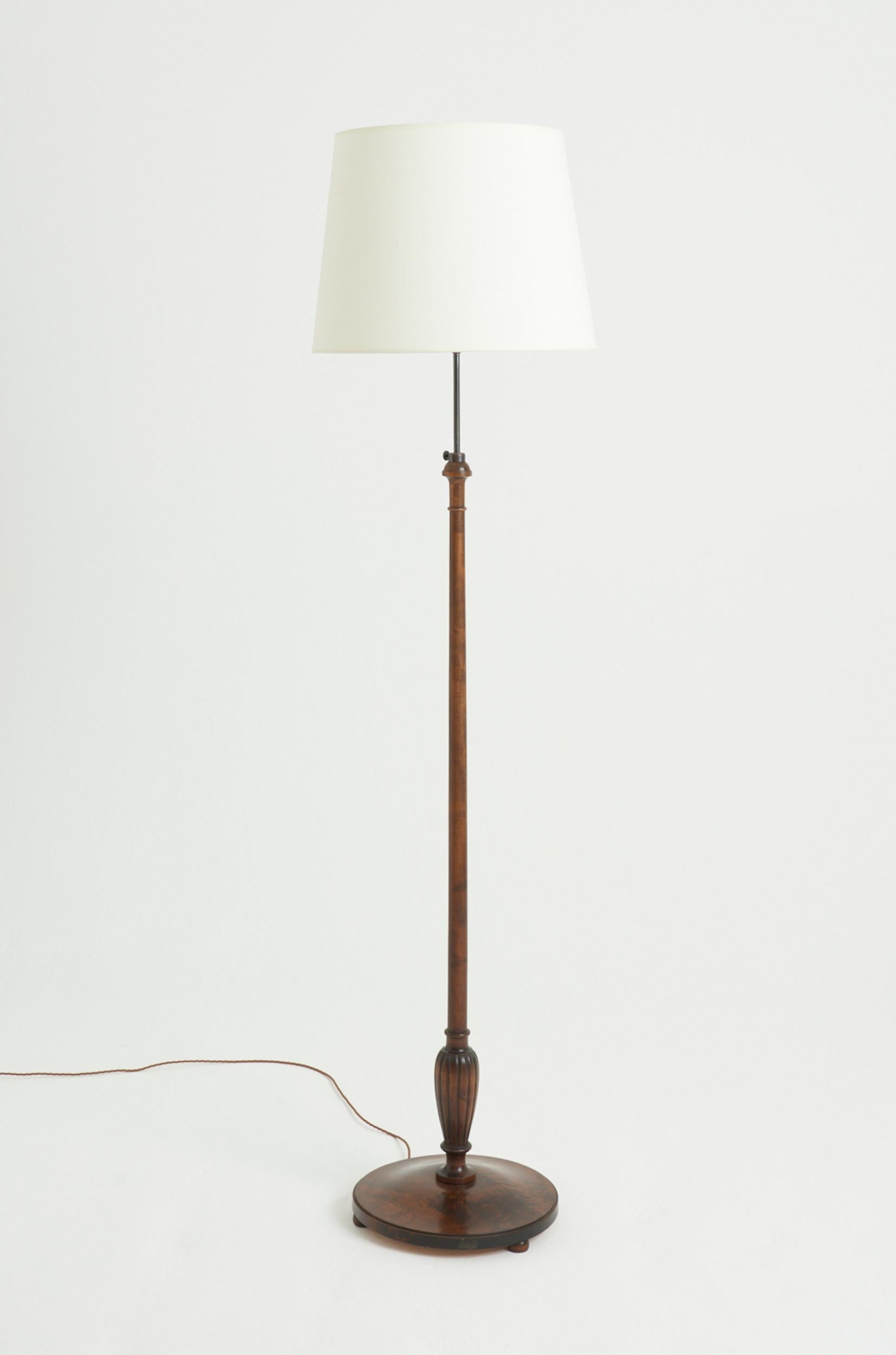 An Art Deco birch floor lamp
Sweden, Circa 1920
With the shade: 208 cm high by 51 cm diameter 
Lamp base only: 170 cm high by 39 cm diameter