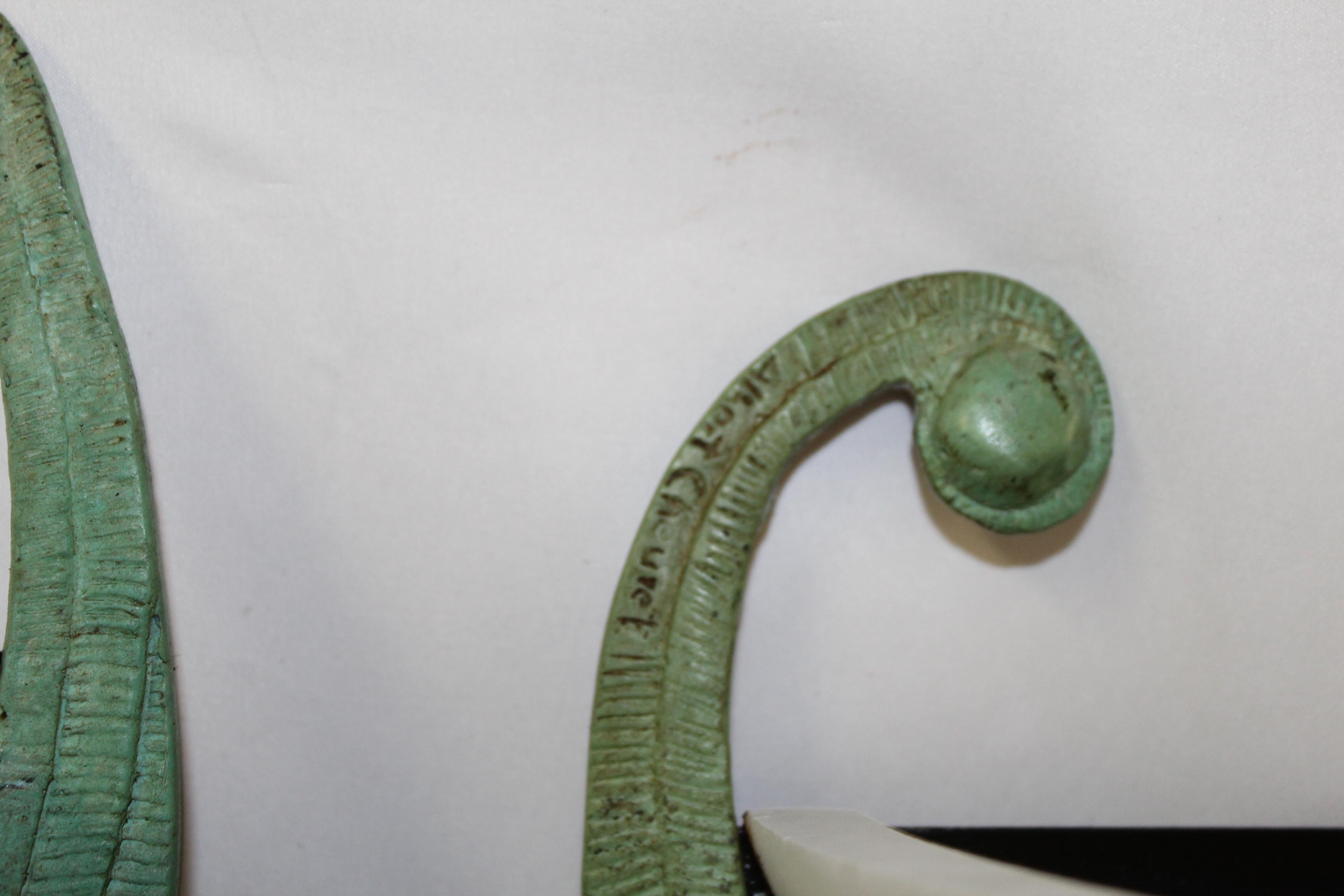 Great looking Crane sconces. Lost wax castings in bronze with green and bronze patina finish. Alabaster shades from Spain. Heavy sconces fit to j-box. These are the most popular sconces that he ever made, and not easy to find now. These will require