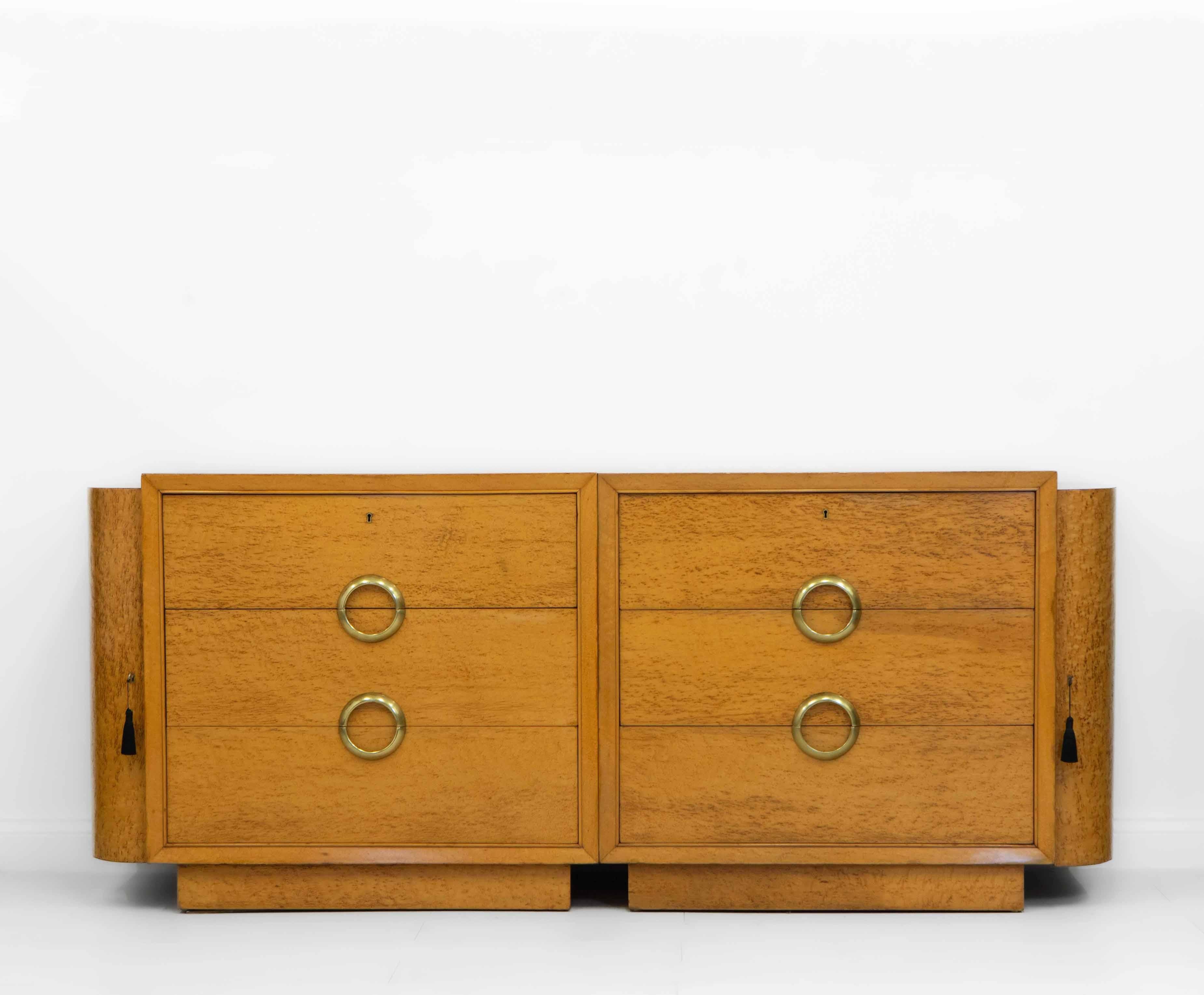 Superb Art Deco sideboard modular chests in bird's eye maple and stylised brass handles, each chest with curved end cabinets. circa 1930s.

The modular chests can be stood together or separately - they are finished on all sides. There have been