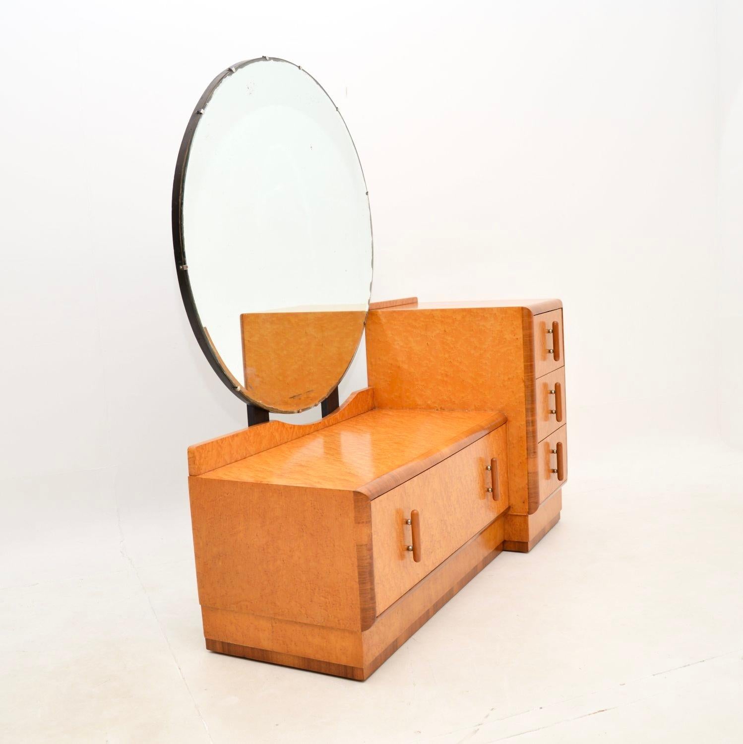 A stunning Art Deco birds eye maple and walnut dressing table, made in England and dating from the 1920-30’s.

It is of superb quality with a very stylish and practical design. The birds eye maple has a gorgeous colour tone and beautiful grain