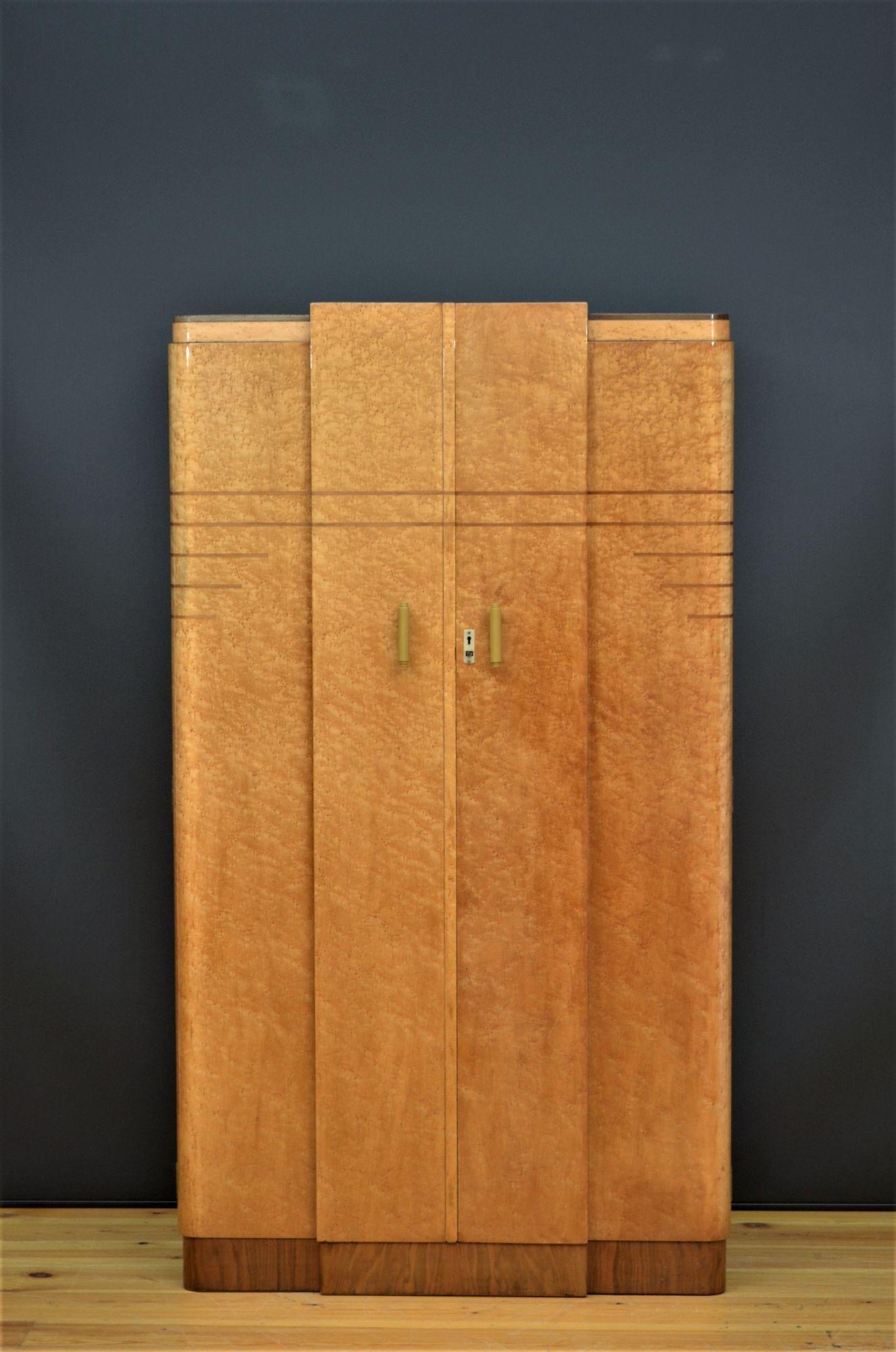 Fine Art Deco Birdseye maple bedroom suite comprising three door wardrobe, two door wardrobe dressing table with a stool and a bed with tow bedside cabinets. All in home ready condition. c1930
2 door wardrobe:
H69.5