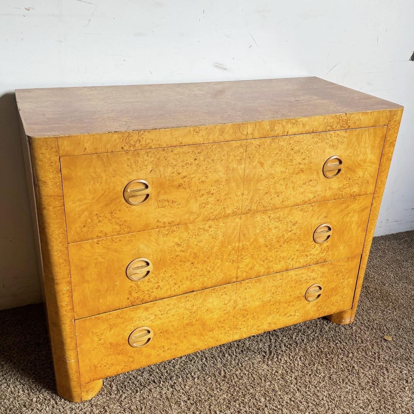 Introduce the elegance of the Art Deco era into your home with this Bird's Eye Maple Veneer Chest of Drawers. Featuring luxurious bird's eye maple veneer, this chest offers a sleek design with multiple drawers for ample storage. Stylish handles