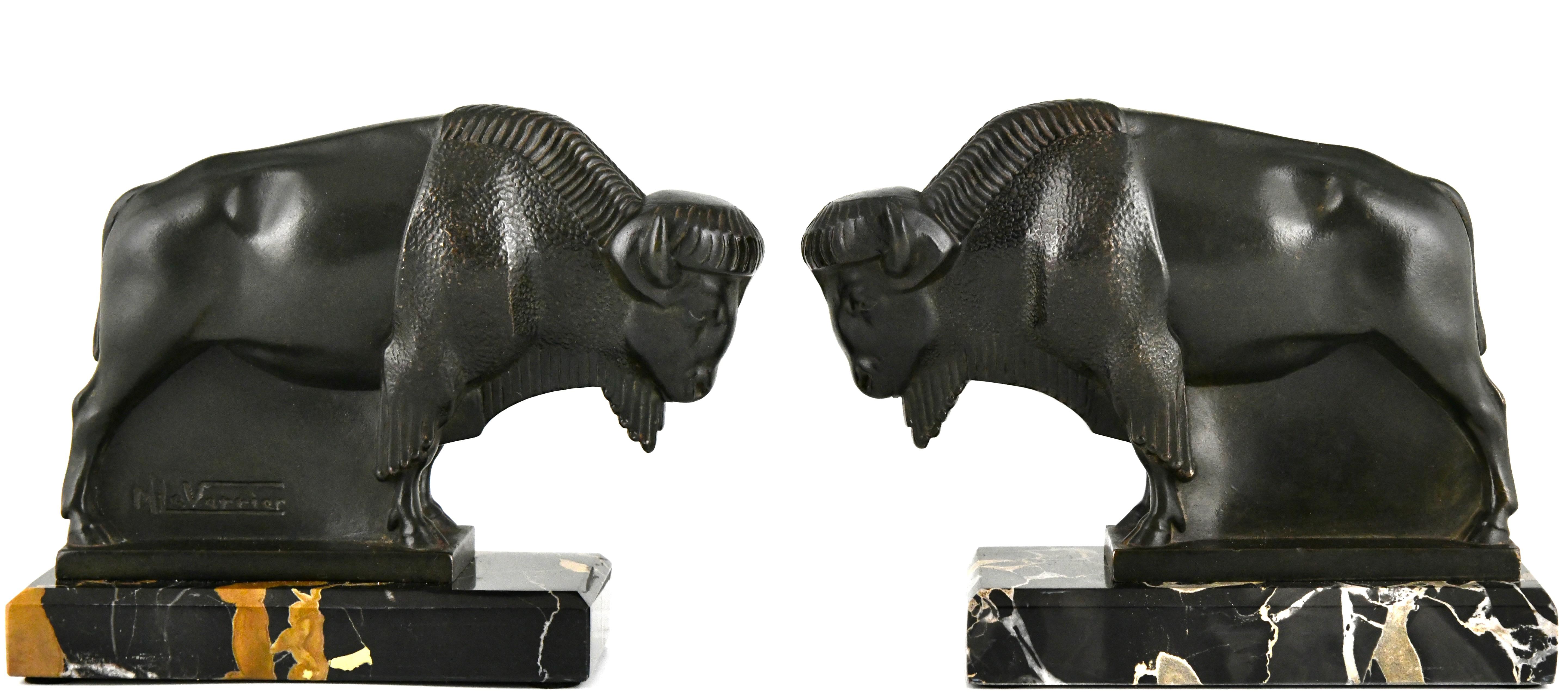 French Art Deco bison bookends by Max Le Verrier original 1930 on Portor marble base.  For Sale