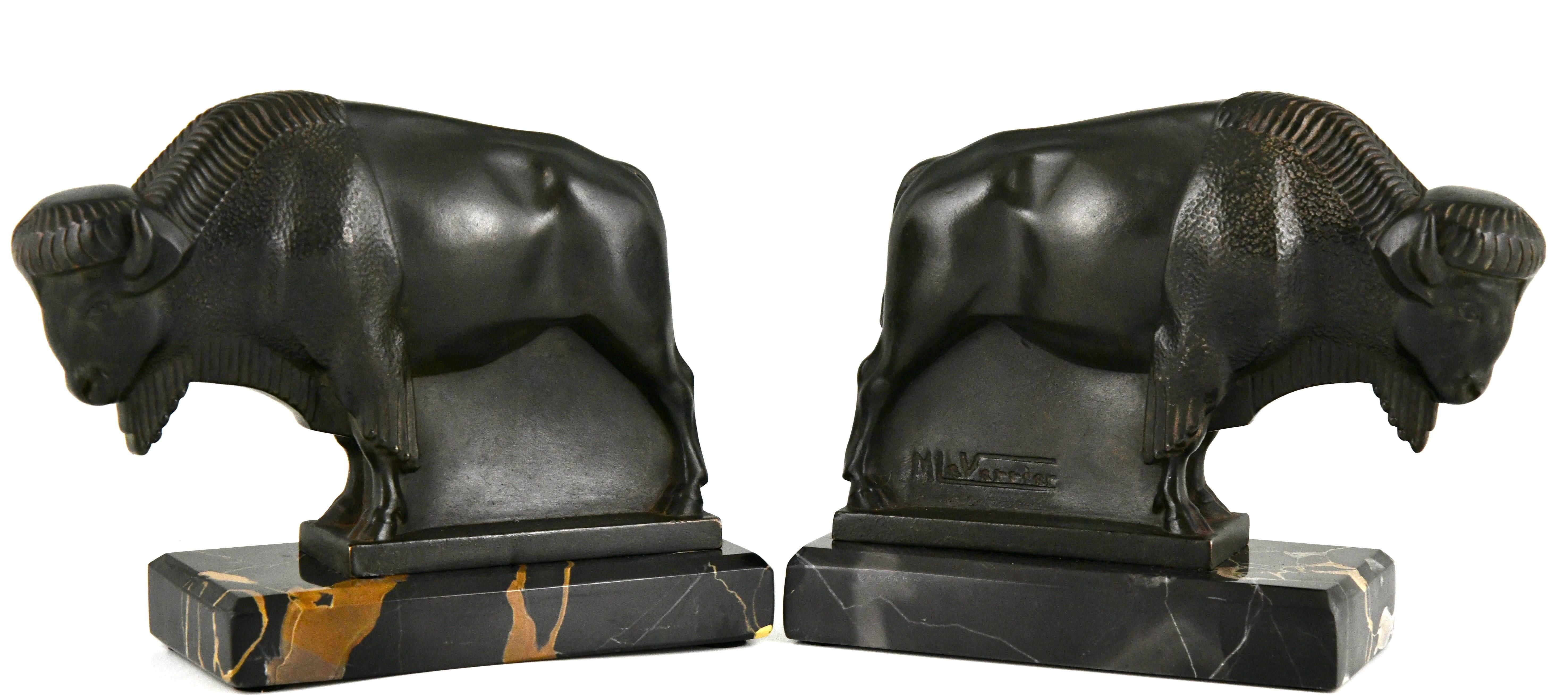 Patinated Art Deco bison bookends by Max Le Verrier original 1930 on Portor marble base.  For Sale