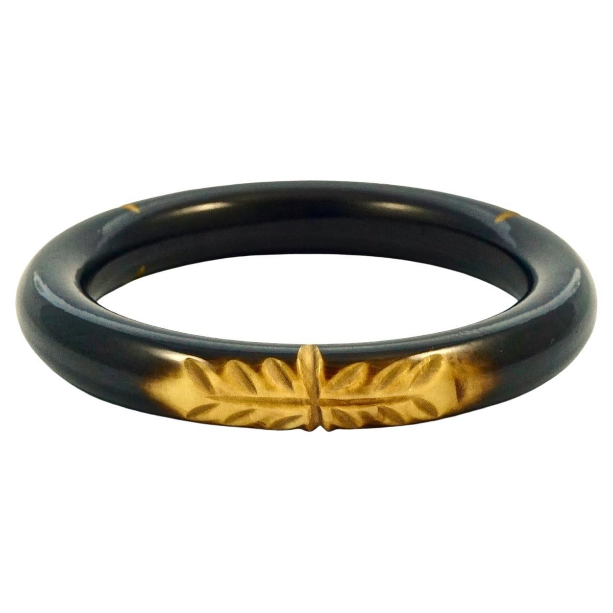 Art Deco Black and Marbled Yellow Carved Leaves Bakelite Bangle For Sale