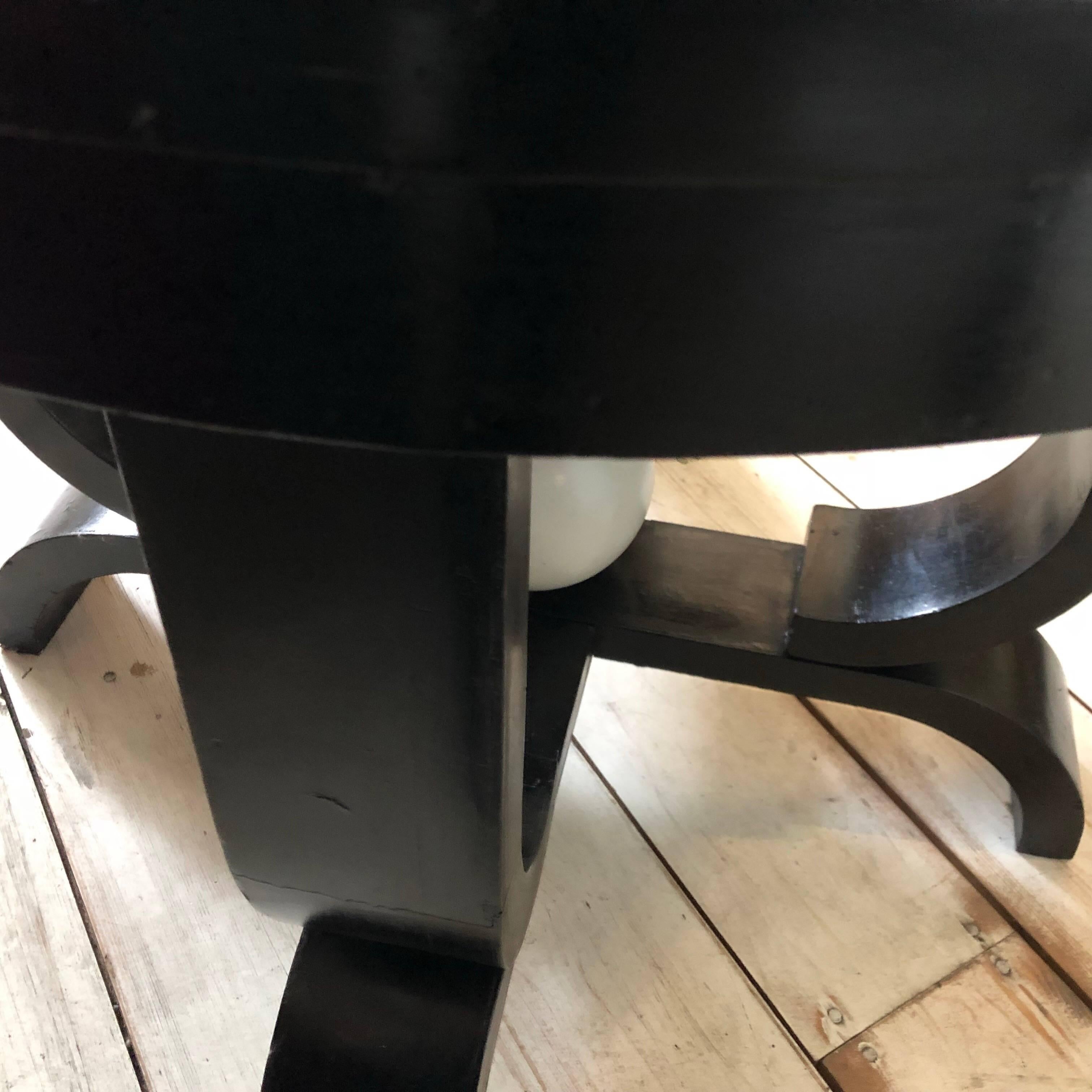Stylish black wood table with a painted white wood ball, bought and certainly made in France in 1930. Table is in original conditions.