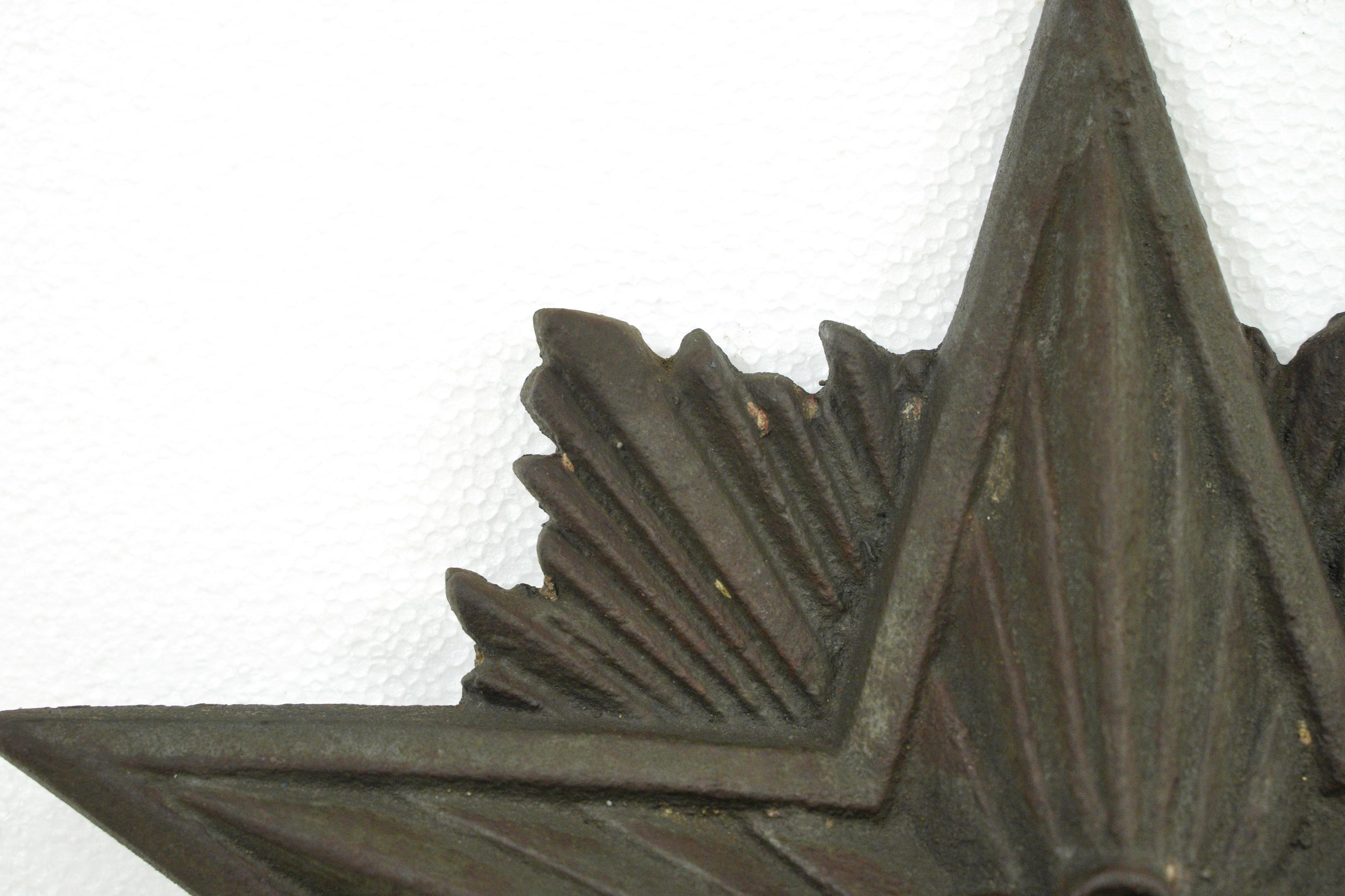 1930s Art Deco style building star. Made from cast iron. These were used under the roof line on brick buildings. One available. Please note, this item is located in one of our NYC locations.