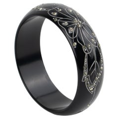 Art Deco Black Galalith Jeweled Bracelet Bangle with Carved Floral Design