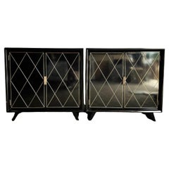 Paire de commodes Art Déco laquées noir et or