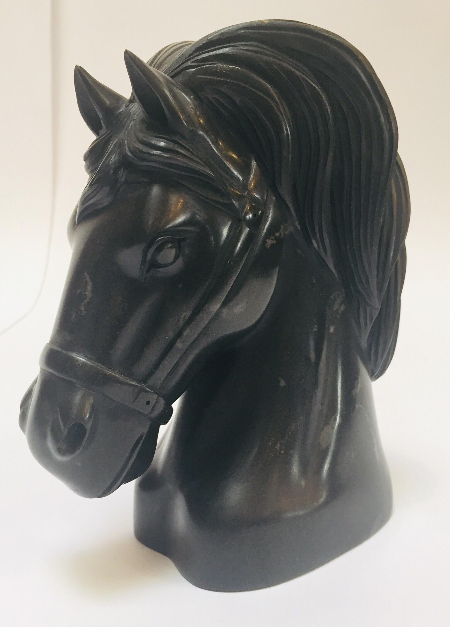 Black Marble horse head sculpture, great to use on a desk as a paper weight or decorative object around the house or office.
Equestrian Gucci, Hermes style horse bust with bridle.
Measure: 4