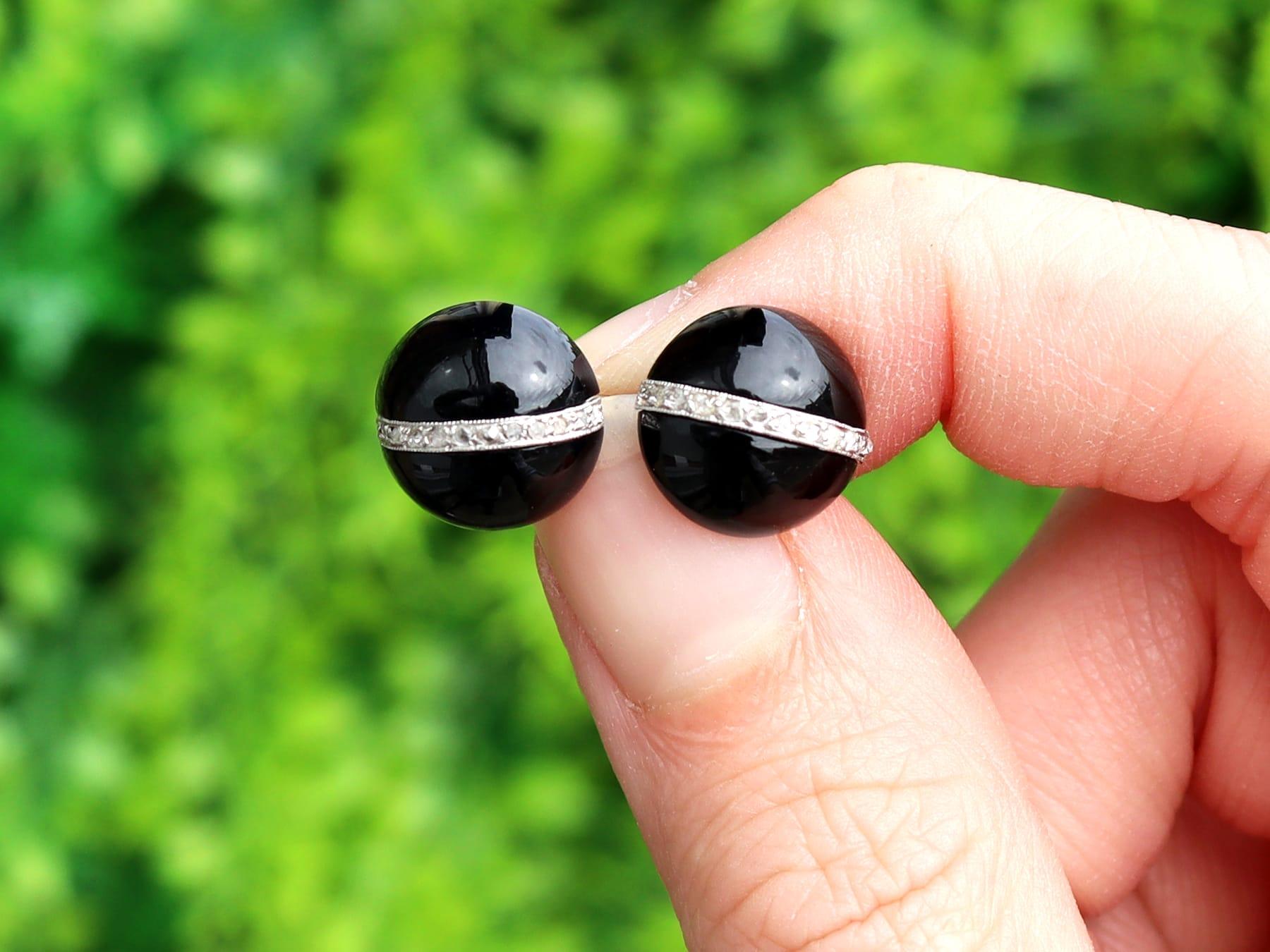 A fine and impressive pair of Art Deco black onyx and 0.33 carat diamond, 18 karat white gold cufflinks; part of our diverse antique jewelry collections.

These fine and impressive antique onyx and diamond cufflinks have been crafted in 18k white