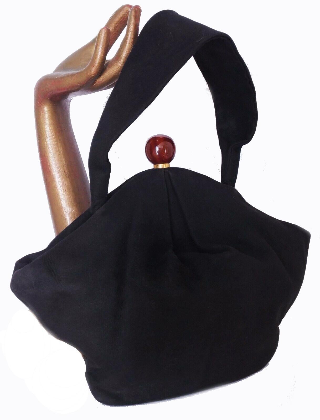 For your consideration is this superbly stylish and rare 1930s-1940s Art Deco black suede bakelite grab bag. Labelled 'Made in France' to the inside. This bag feels lovely to use with its soft body and light weight. Beautiful shape and size, a