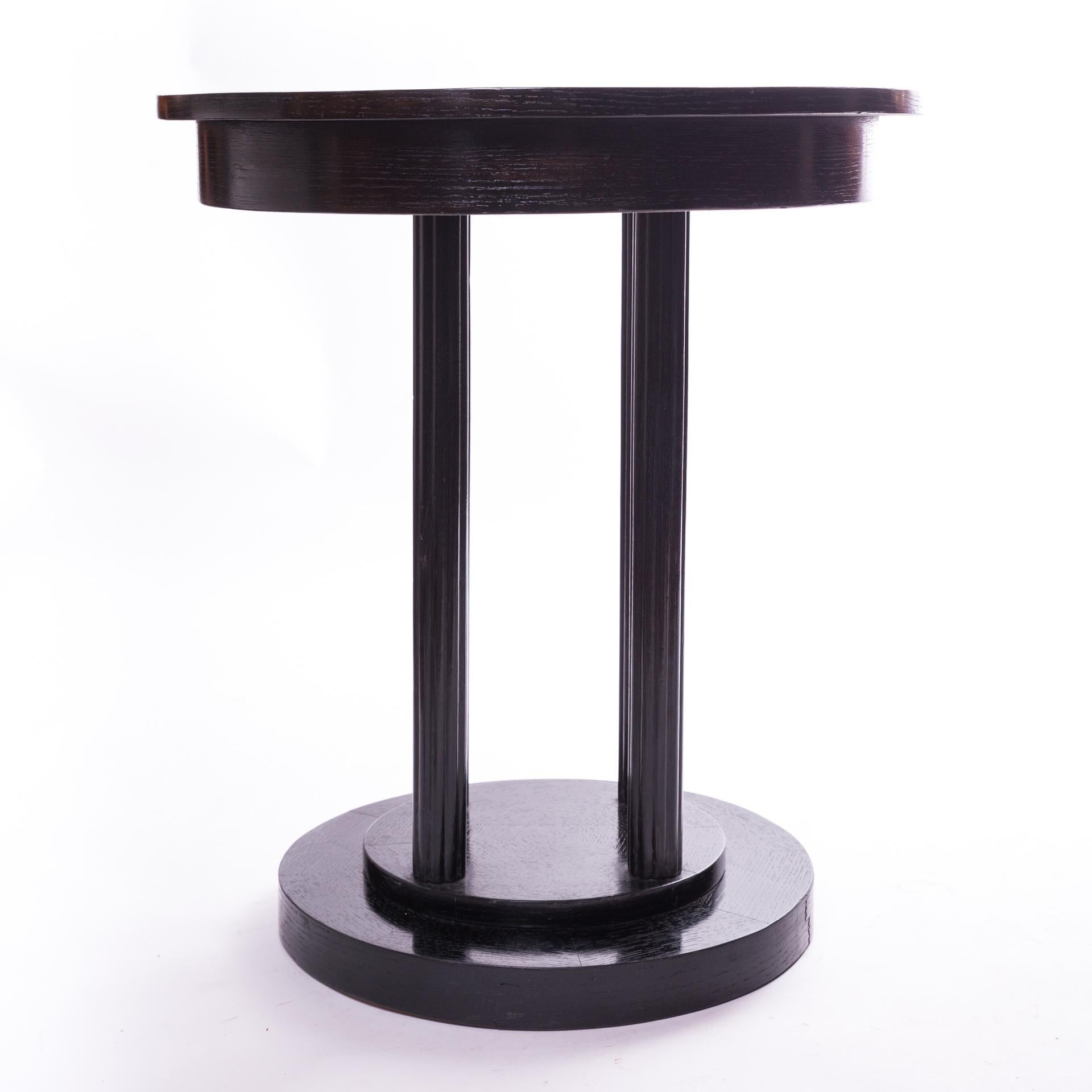 Black Art Deco table, referring in form to Viennese Thonet furniture. It comes from 1910-1920. Wooden, black stained and polished. Visible wood structure.