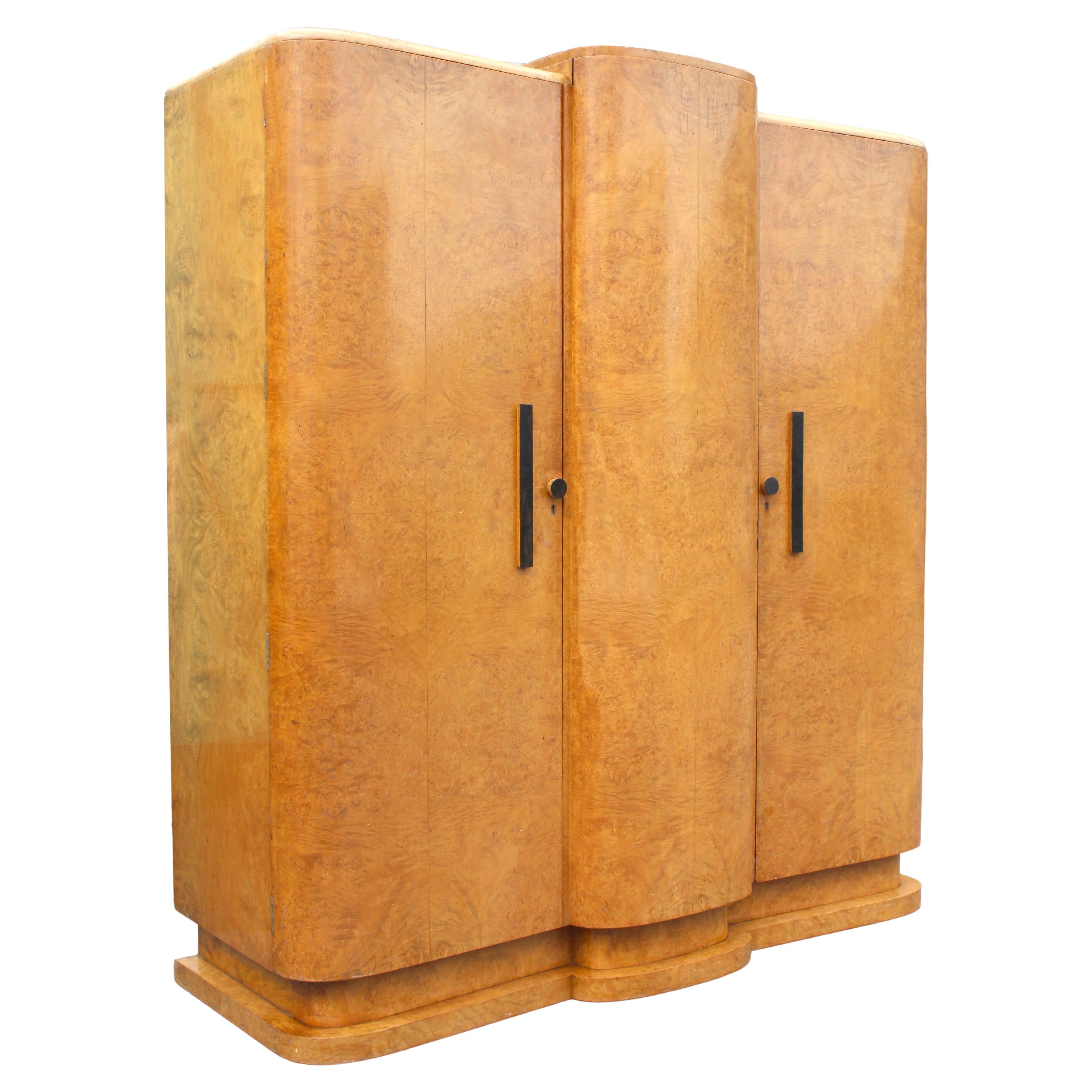 For your consideration is this very high quality Art Deco blonde burr maple triple three door wardrobe . Made in the 1930's this beautiful wardrobe exudes quality and style and offers a very generous amount of internal storage. The left side has