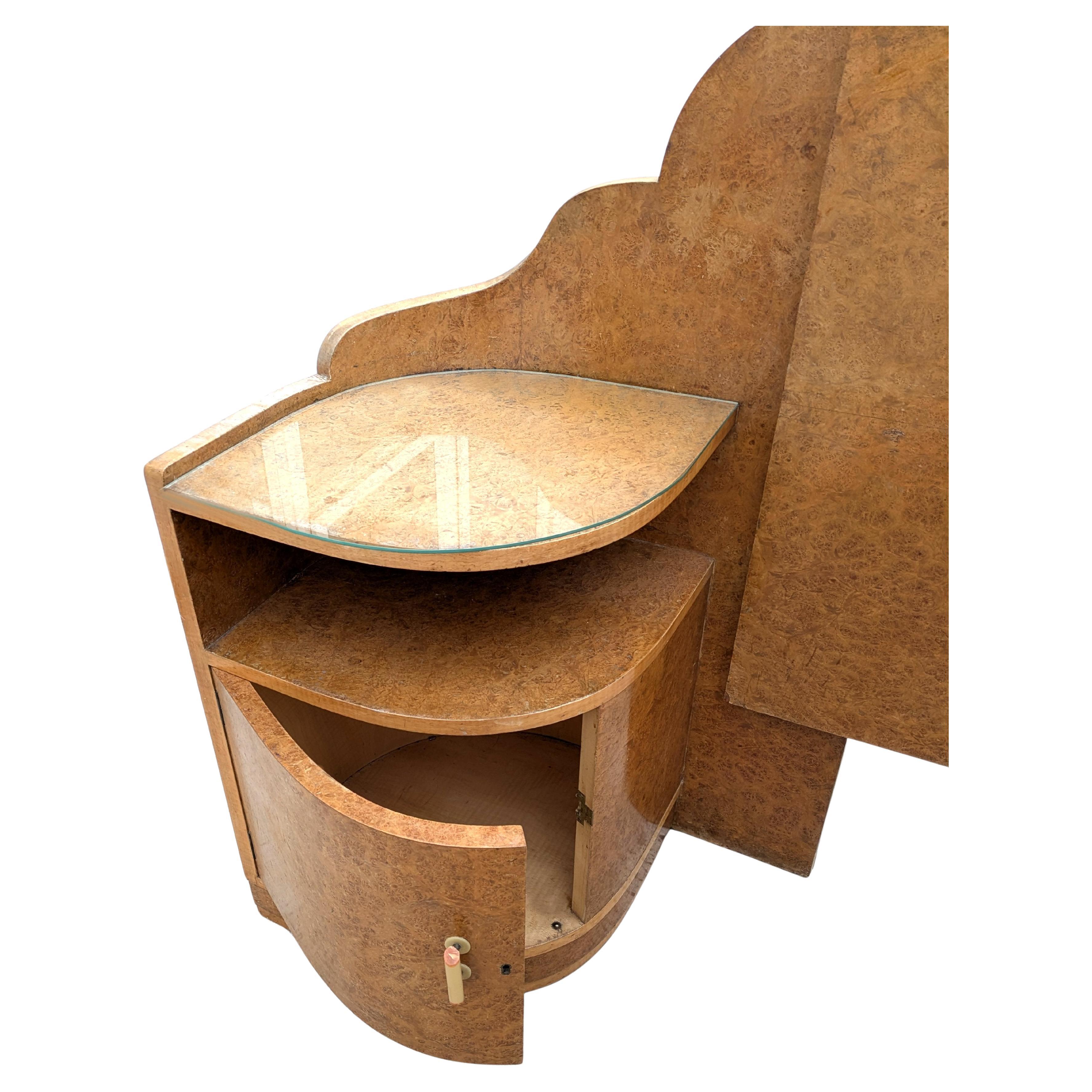 Incredibly stylish and so indicative of this bygone era is this Art Deco 1930s double bed with integral nightstands. Veneered in the most glorious maple book paged figured veneers, it really is a joy to look at and with an over-all odeon cloud shape