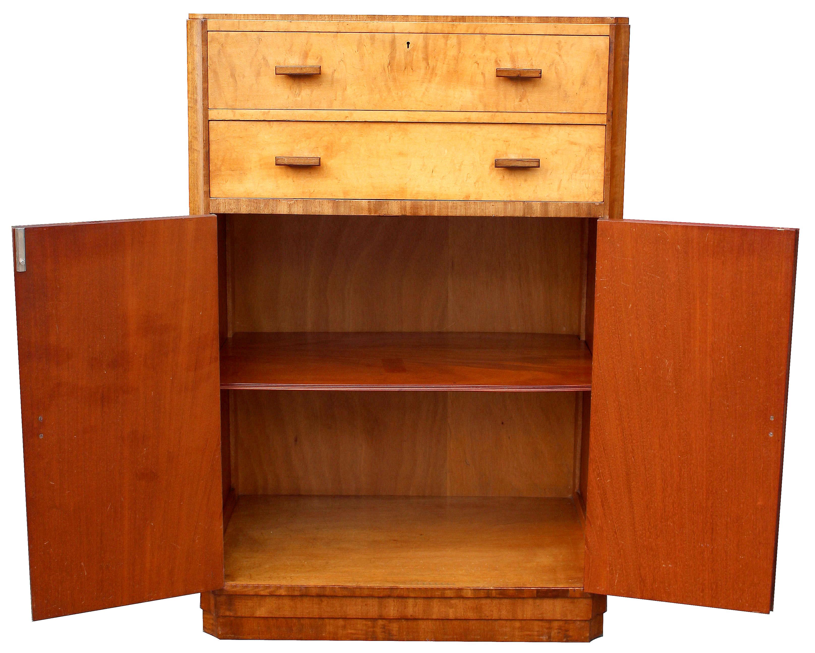 For your consideration is this very high quality two tone tallboy in fiddle grain mahogany and pale blonde Maple veneer with walnut feather banding borders. This beautiful tallboy exudes quality and style and offers a very generous amount of