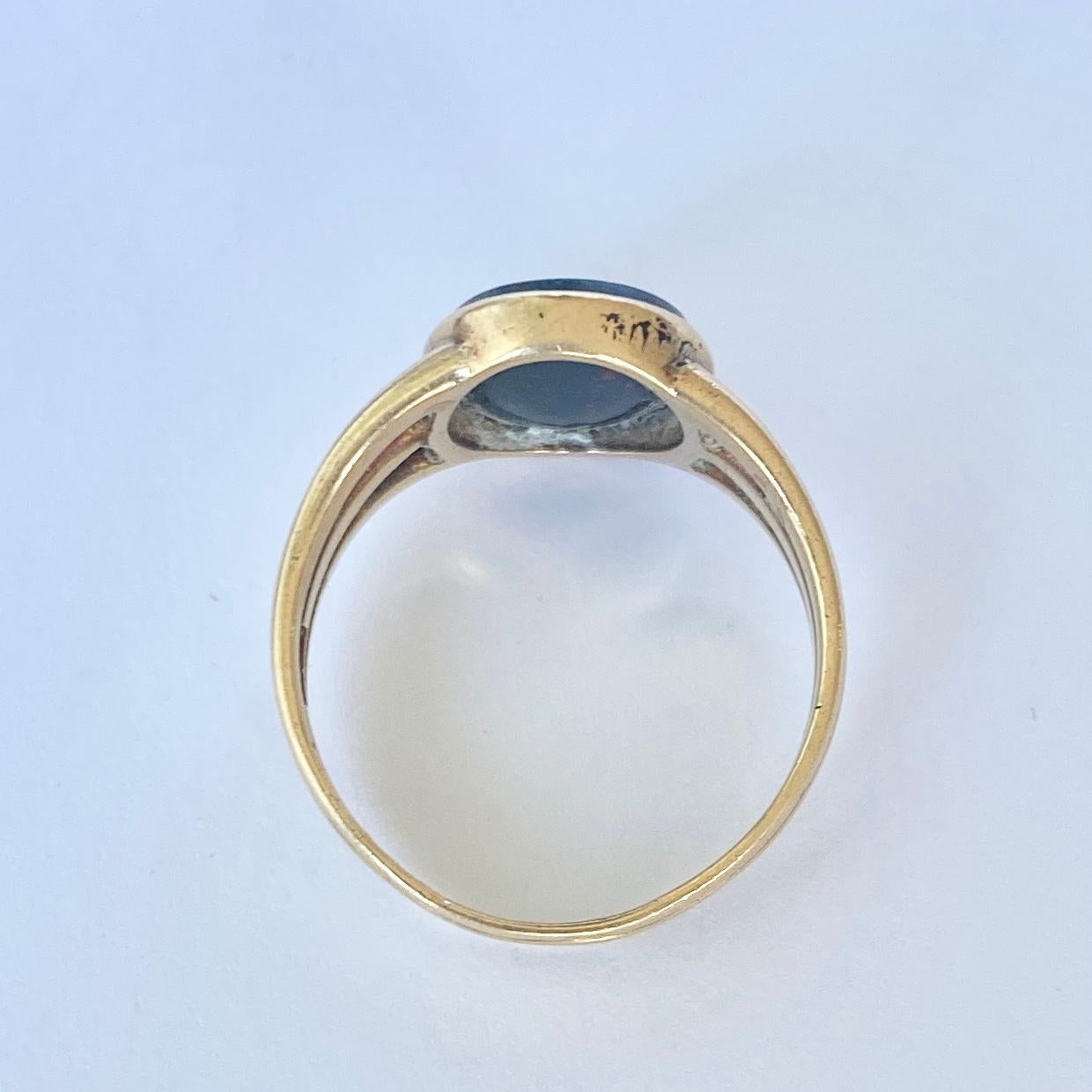 This chunky bloodstone signet ring has engraving of the initials 'CCS' highlighted in gold. Modelled in 18carat gold. Fully hallmarked London 1917.

Ring Size:U or 10
Stone Dimensions: 13x10mm

Weight: 5.9g