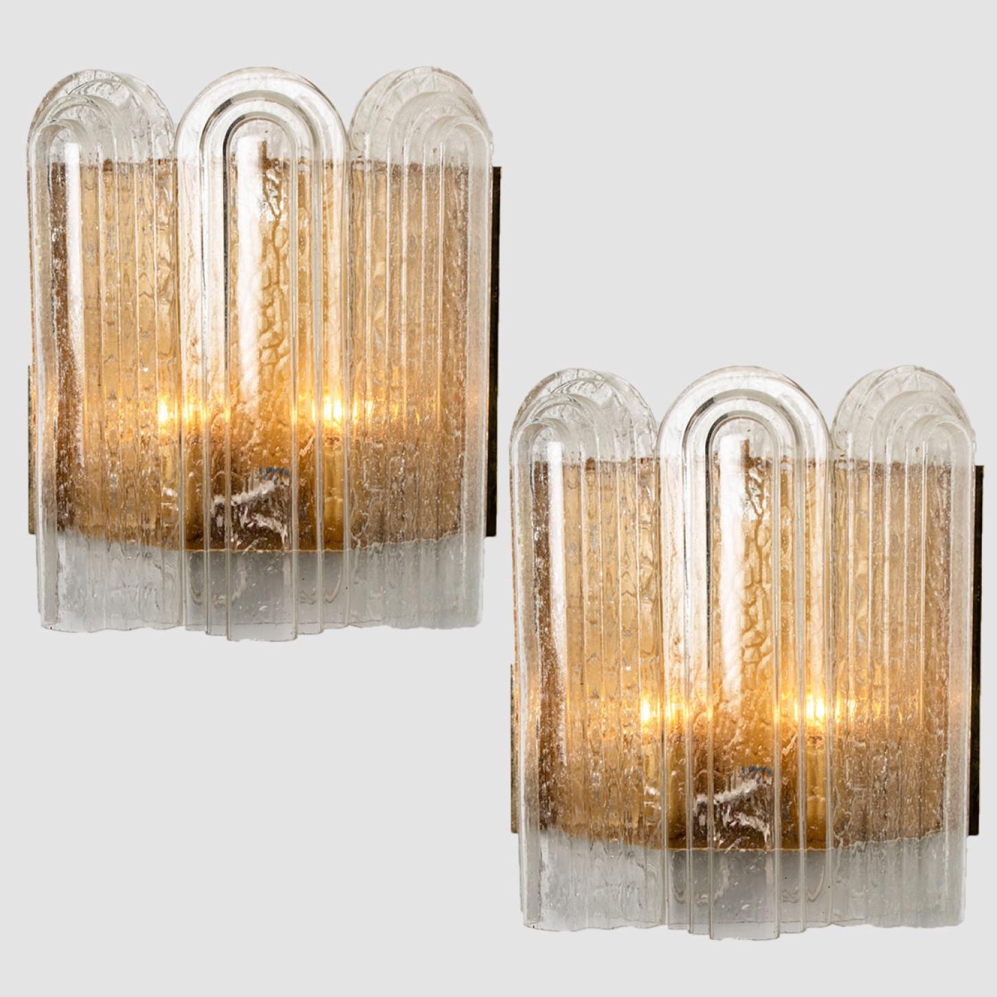 These blown glass wall sconces are designed and manufactured by the iconic firm of Doria Leuchten, Germany in 1960.
They are designed with a brass back plate and art deco style glass shades. High-end pieces.
Dimensions
H 17.72 in (45cm) x W 11.81