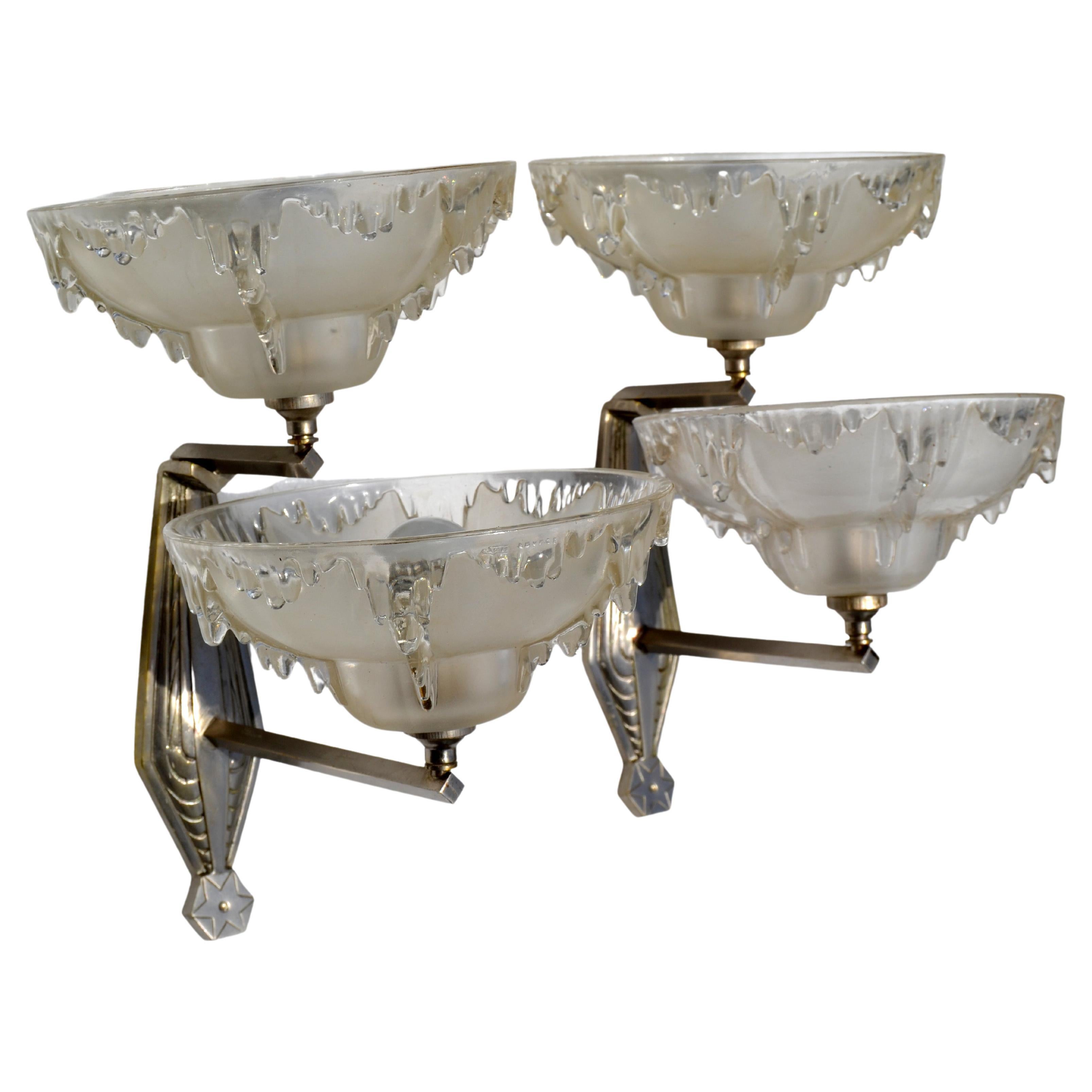 Superb pair of clear blown Murano glass and brass wall sconces 
Original European wiring and in working condition. Each Sconce takes two special light bulbs 40 watt max. as shown in pictures. 
Measurements:
Murano Cups: Diameter 8 x 6 inches