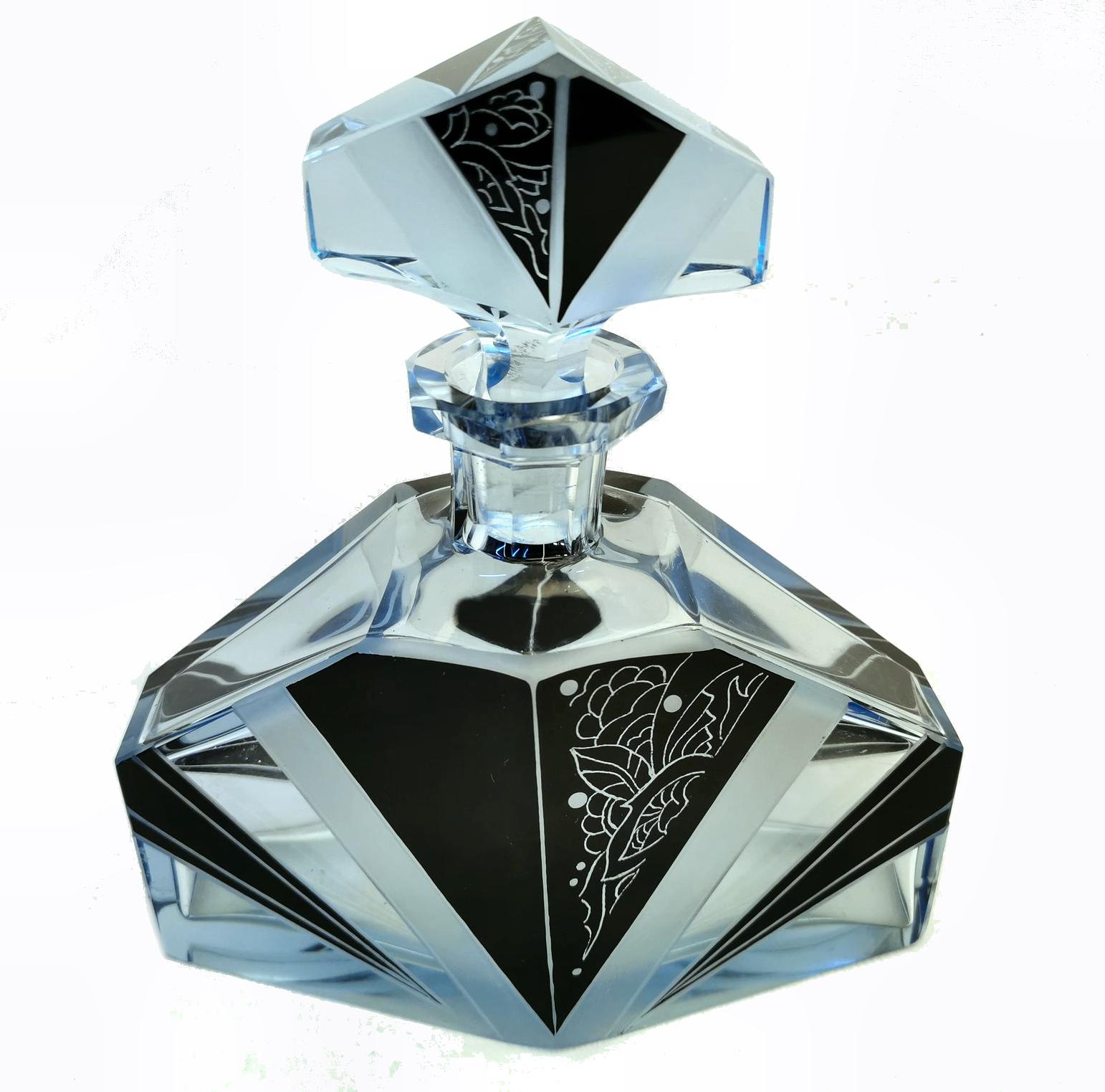 Beautiful Art Deco blue and black decanter set, a wonderful addition to a barware collection. Originating from Czech republic this striking set has a very desirable geometric pattern with blue glass and black overlay enamel decoration. No chips,