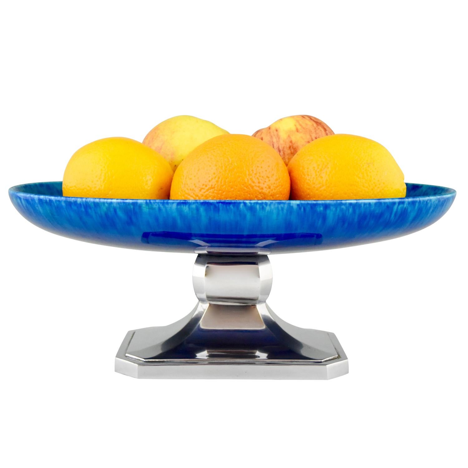 Lovely Art Deco fruit dish or centerpiece in a beautiful blue glazed ceramic standing on a chromed metal base. This piece has been created circa 1930 in France by Paul Milet for Sèvres.
1.8 KG.