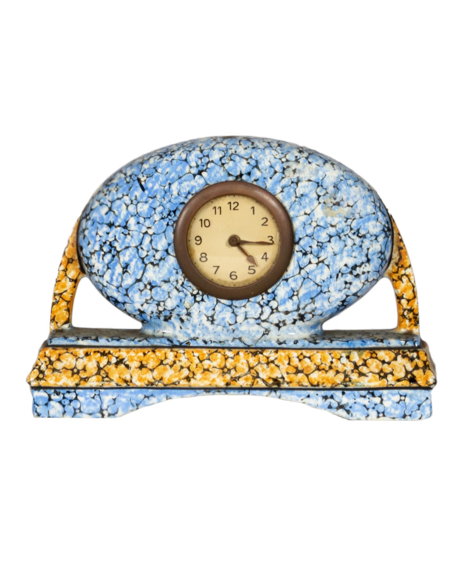A belgian Art Deco blue ceramic Majolique mantel clock set by Manufacturer Faïencerie de la Majolique de Wasmuel. 
This fireplace clock has a matching a pair of vases.
The pieces of blue faience are coated in pewter or glazed, from the moorish