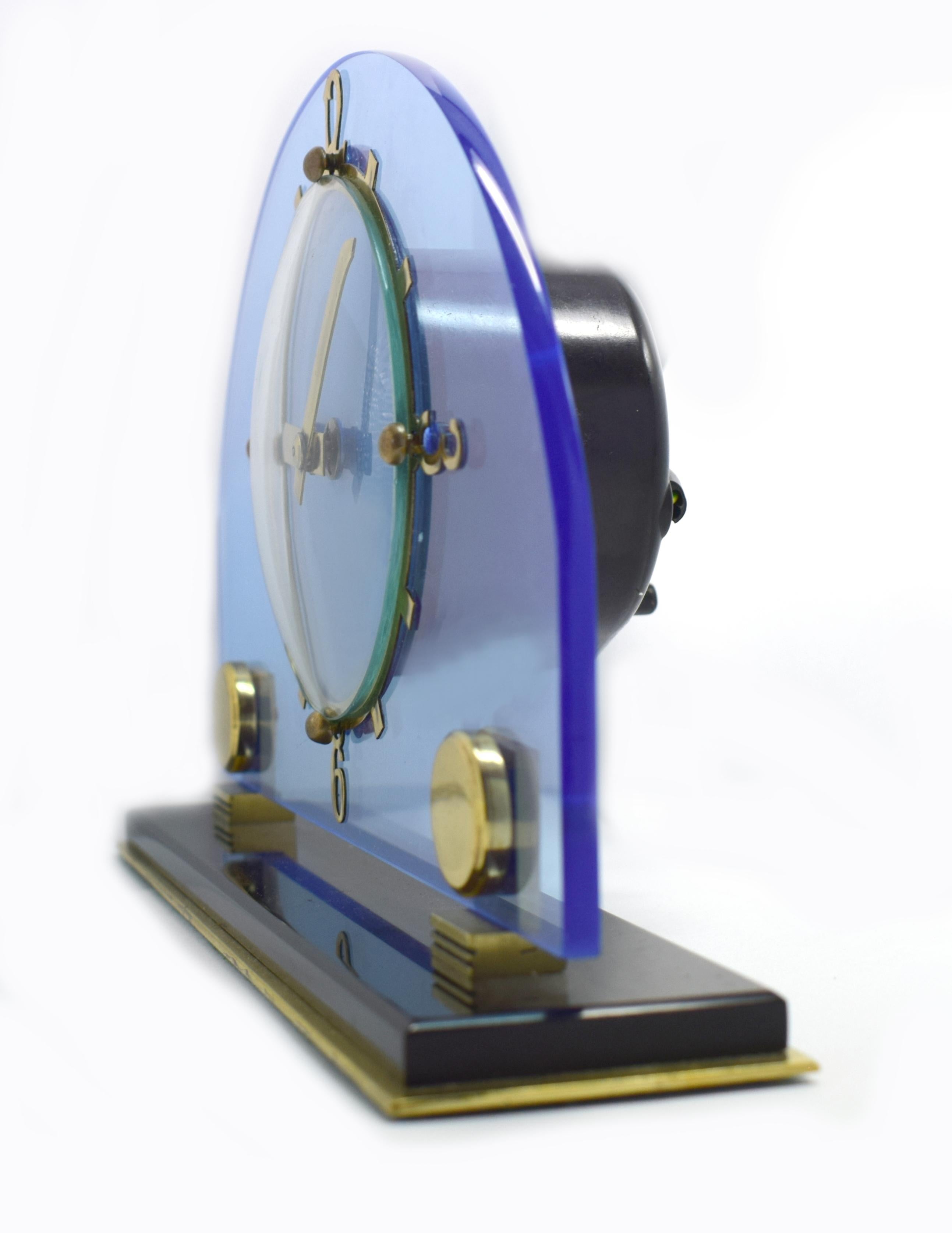 Original 1930s blue perspex clock by the English clock makers Smiths. Beautiful blue dial face which sits of a jet black perspex plinth with brass numerals and accents. Fabulous condition, full working order. (We can provide a power adaptor so the