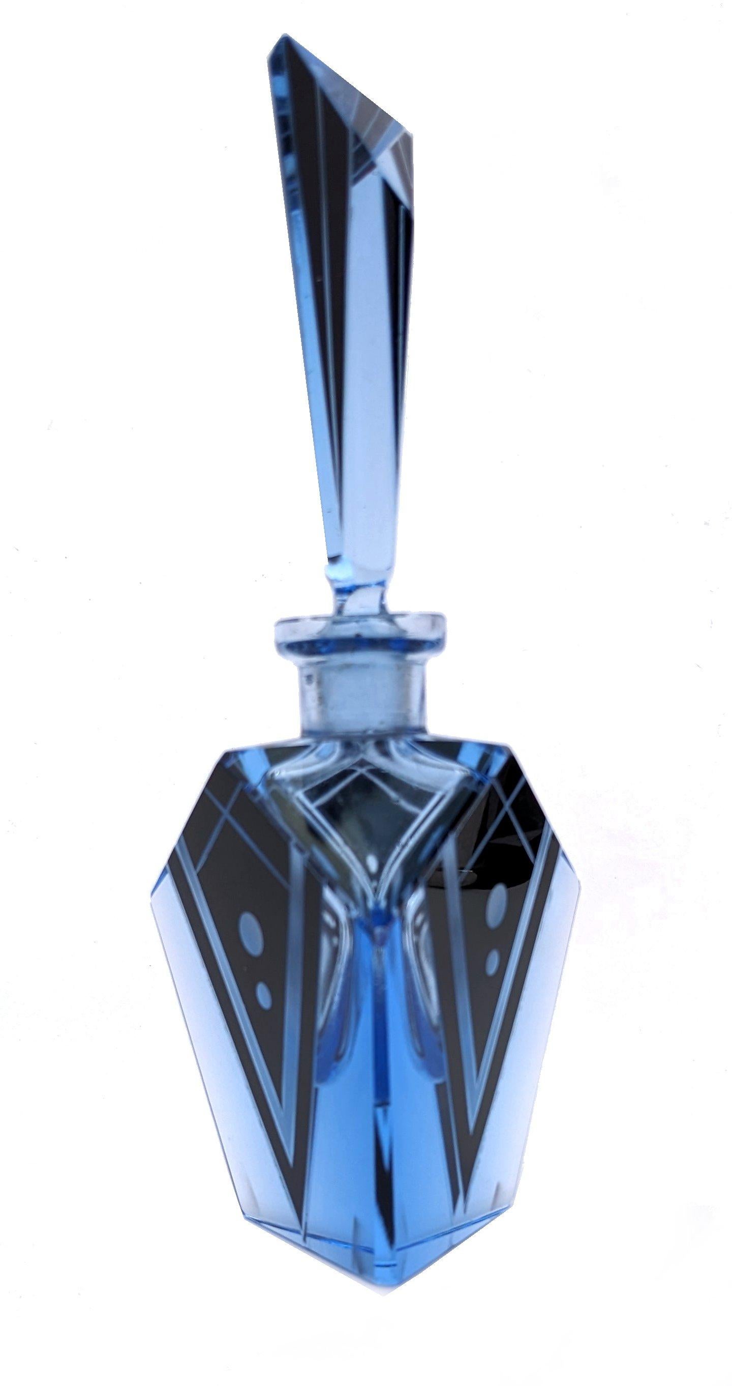 Stunning Art Deco blue glass perfume scent bottle with black enamel geometric decoration. Beautiful deep blue glass, very collectable dating from the 1930s. Czech in origin. Superb black enamelled geometric design with etched glass detailing.