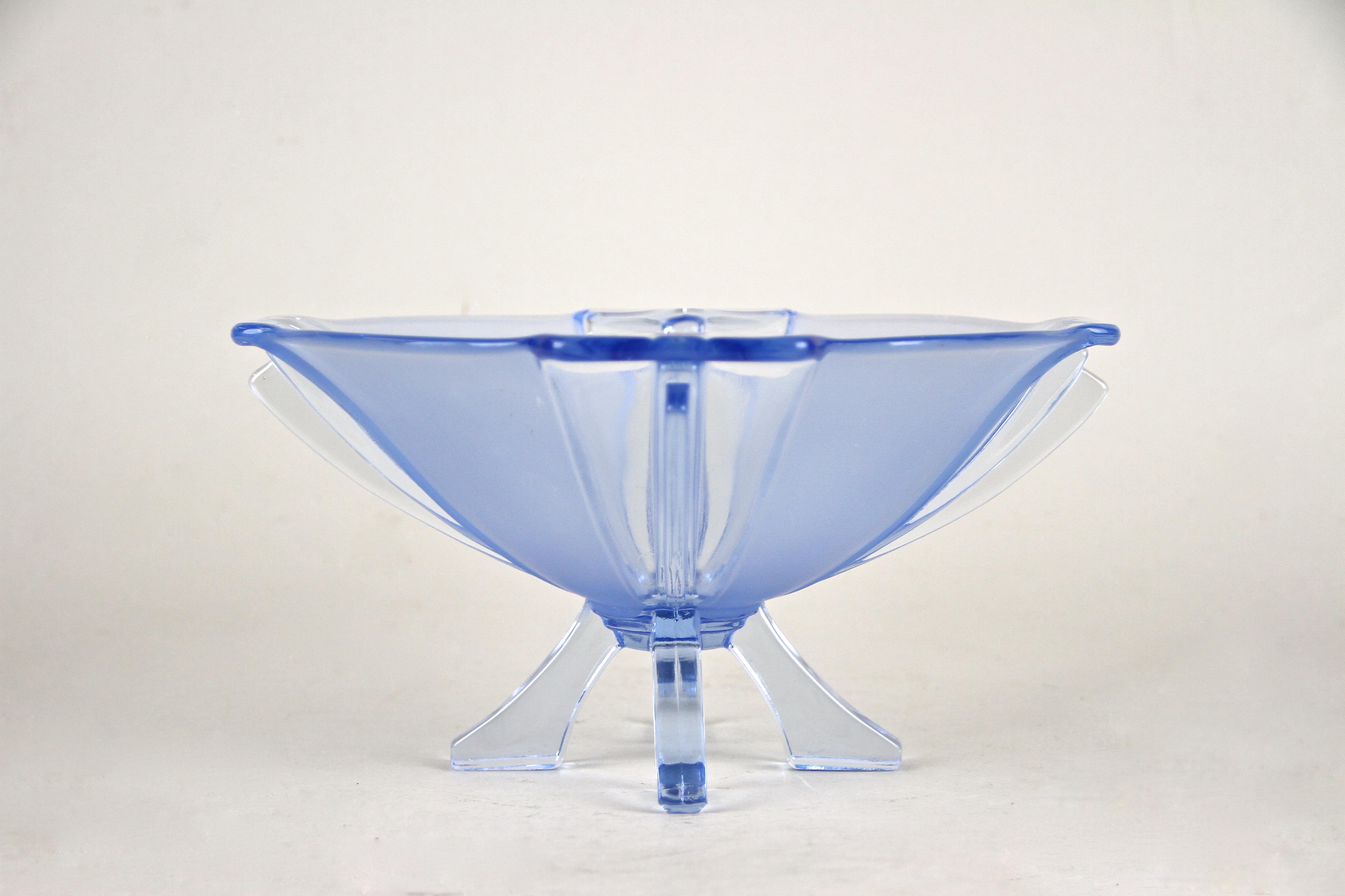 Highly decorative blue Art Deco glass bowl from the early 20th century in Austria. This lovely glass bowl from around 1920 shows an unique design, reflecting the famous Art Deco form language. The elaborate worked glass bowl with satined fields