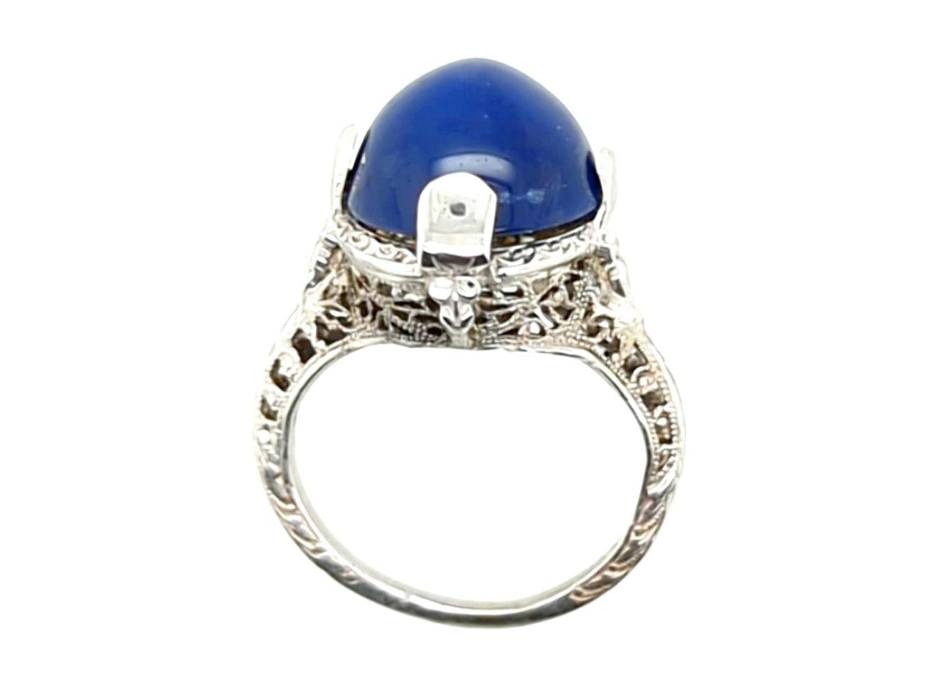 Genuine Original Art Deco Antique from 1930's Blue Linde Star Sapphire Cocktail Ring 18K White Gold 


Featuring a Gorgeous 8.80ct Genuine Oval Cabochon Blue Linde Star Sapphire Center

Finely Engraved Filigree

18K White Gold 

Circa