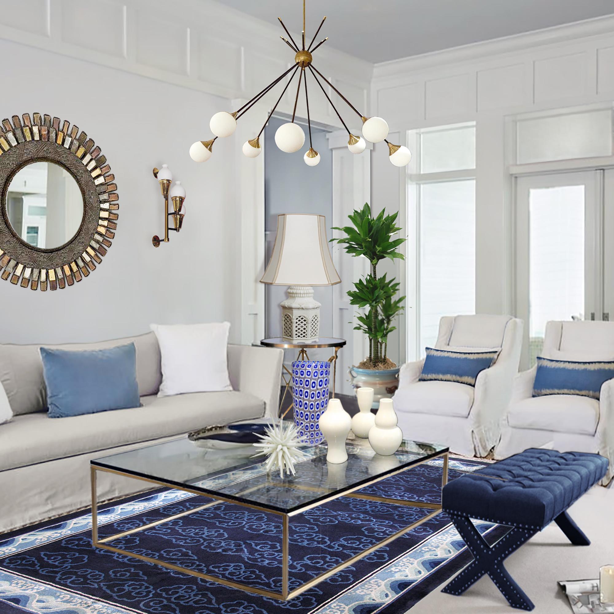 A beautiful silk rug with an Art Deco decor of stylized clouds and waves in lovely shades of blue and ivory, also called Chi and Ruyi. This is a midcentury vintage rug from the 1950s. It is all handmade, piled with pure silk, and has a traditional