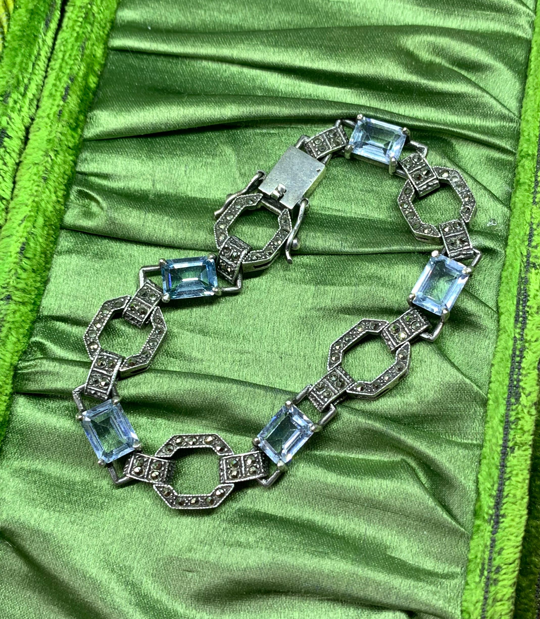 THIS IS A STUNNING ORIGINAL ANTIQUE ART DECO BLUE SPINEL AND MARCASITE STERLING SILVER BRACELET OF THE FINEST QUALITY.  THE NECKLACE IS SET WITH FIVE EMERALD CUT VIVID BLUE SPINEL GEMS SET IN STERLING SILVER WITH MARCASITES IN THIS CLASSIC ART DECO