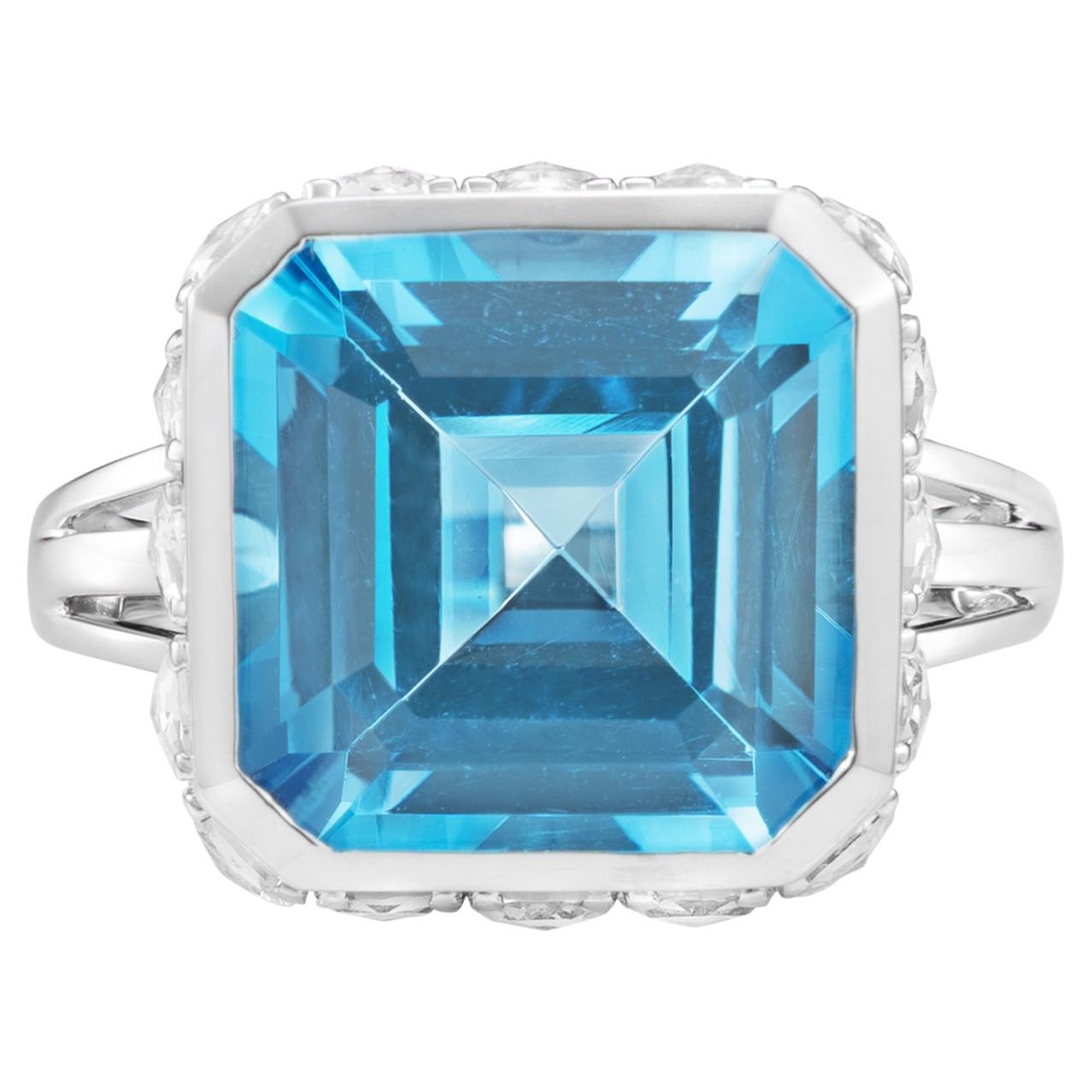 This collection features an suite of bold yet dainty art deco pieces with unique construction. The stunning gemstone vibrantly sits on top of a cluster of diamonds and rose cut white topaz. The unique architecture to construct and combine these