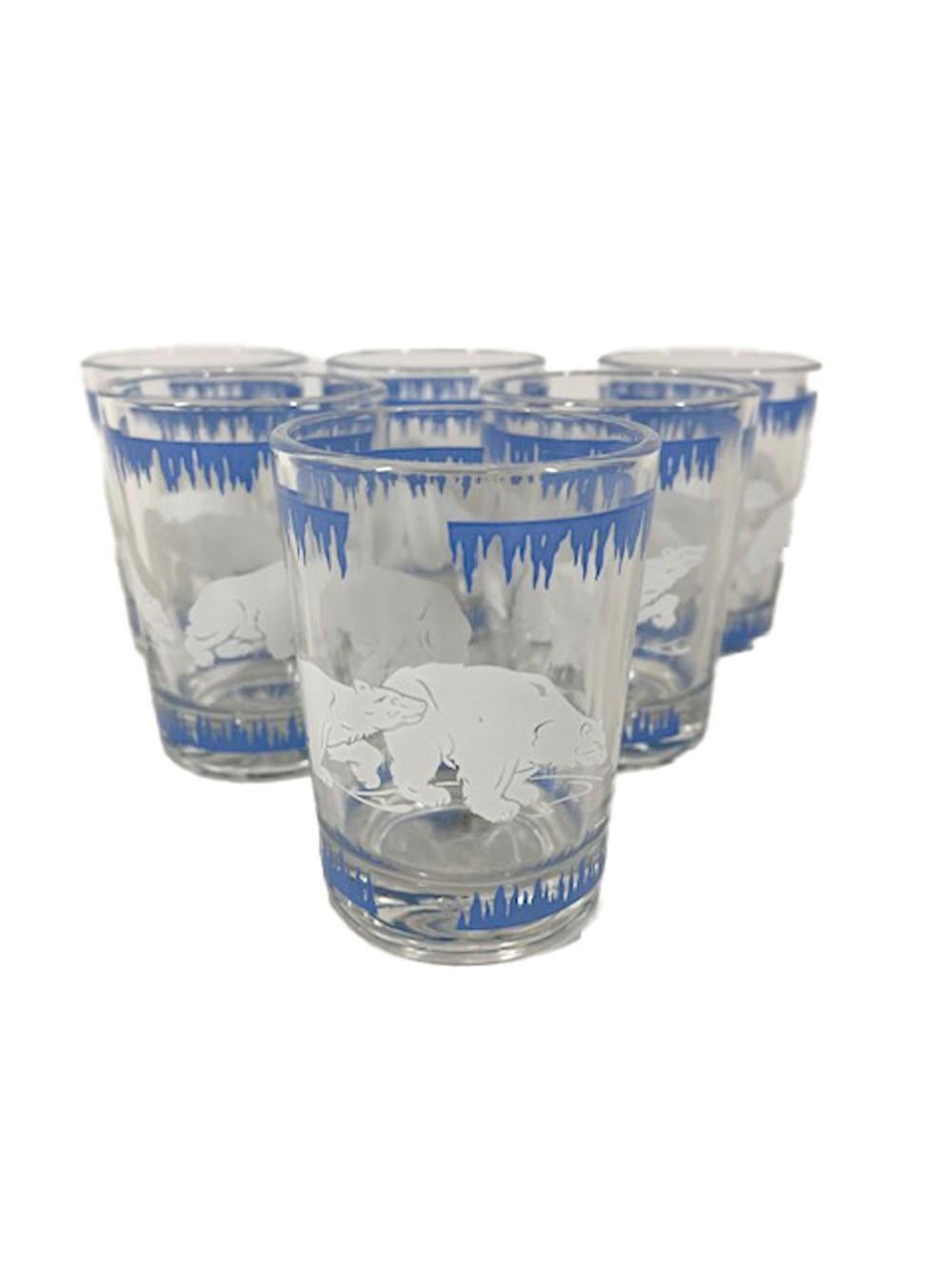 Eight piece Art Deco cocktail set comprising a chrome lidded cocktail shaker, ice bowl and six cocktail glasses. decorated with a band of blue ice above and below white polar bears.